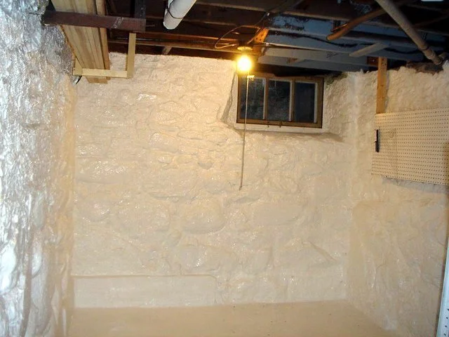 Basement waterproofing system installed on concrete walls to prevent water intrusion and structural damage.