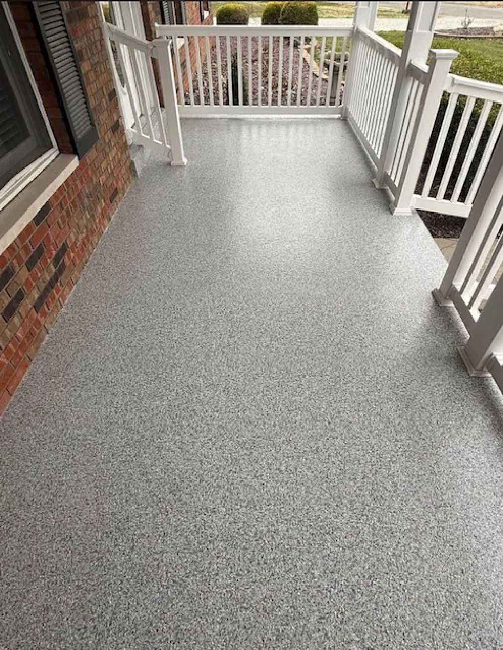 close-up view of a gray and Black Flake Epoxy Porch Flooring finish with textured surface