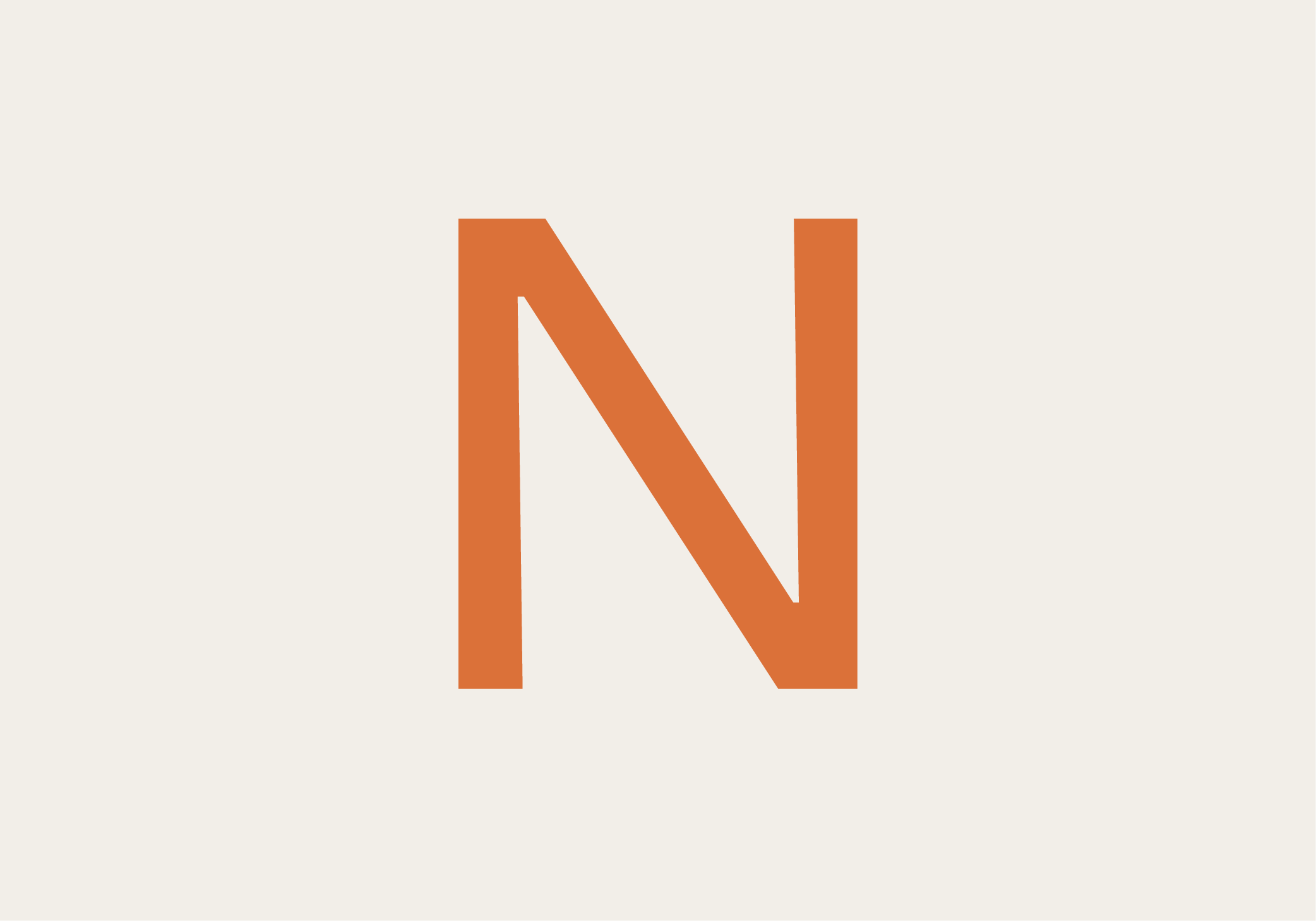 Close-up of a large orange letter 'N' on a white background.