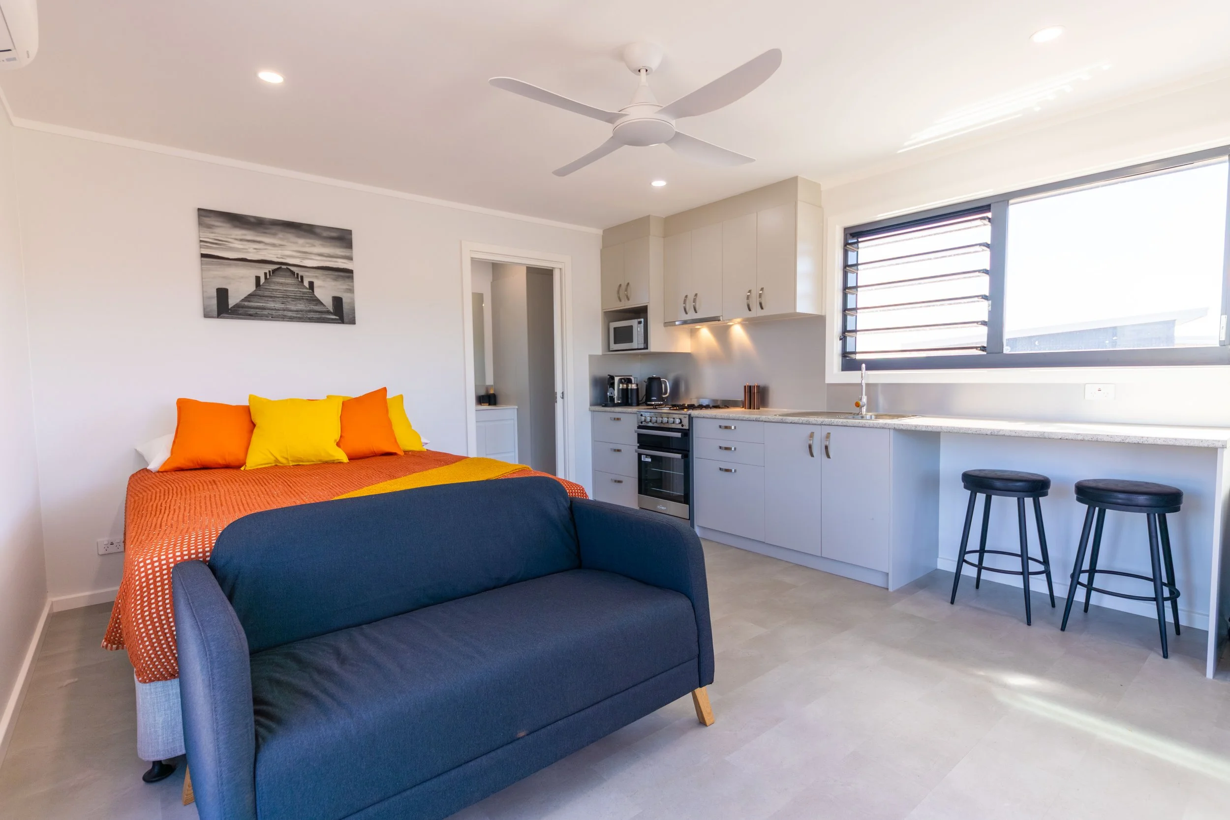 Interior view of the main bedroom and kitchen in the koala cabins on kangaroo island at Kangaroo Island Koala Lodge.