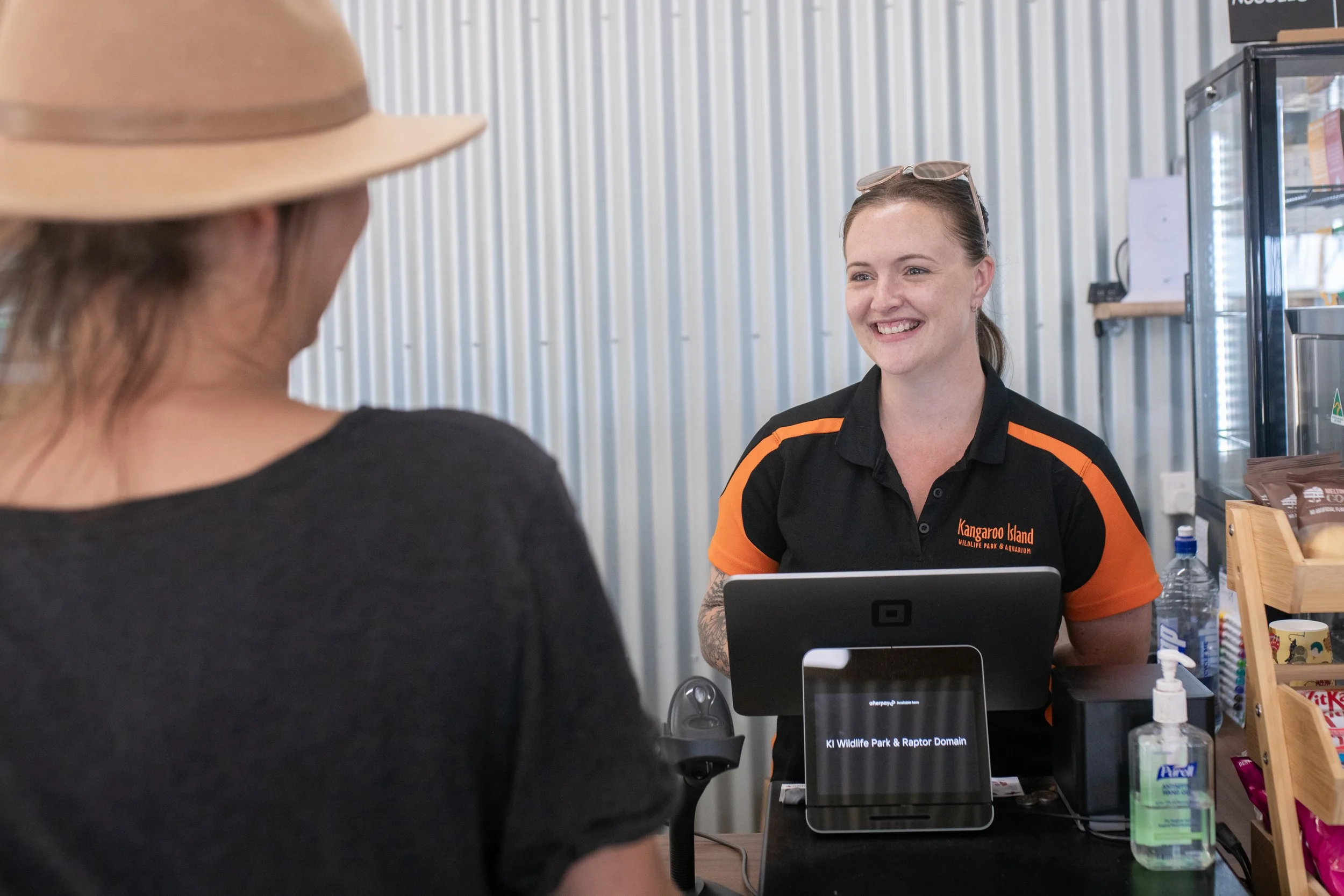 A welcoming woman in the front entrance of the Kangaroo Island Wildlife Park and Raptor Domain where you can get tickets to visit the wildlife on Kangaroo Island.