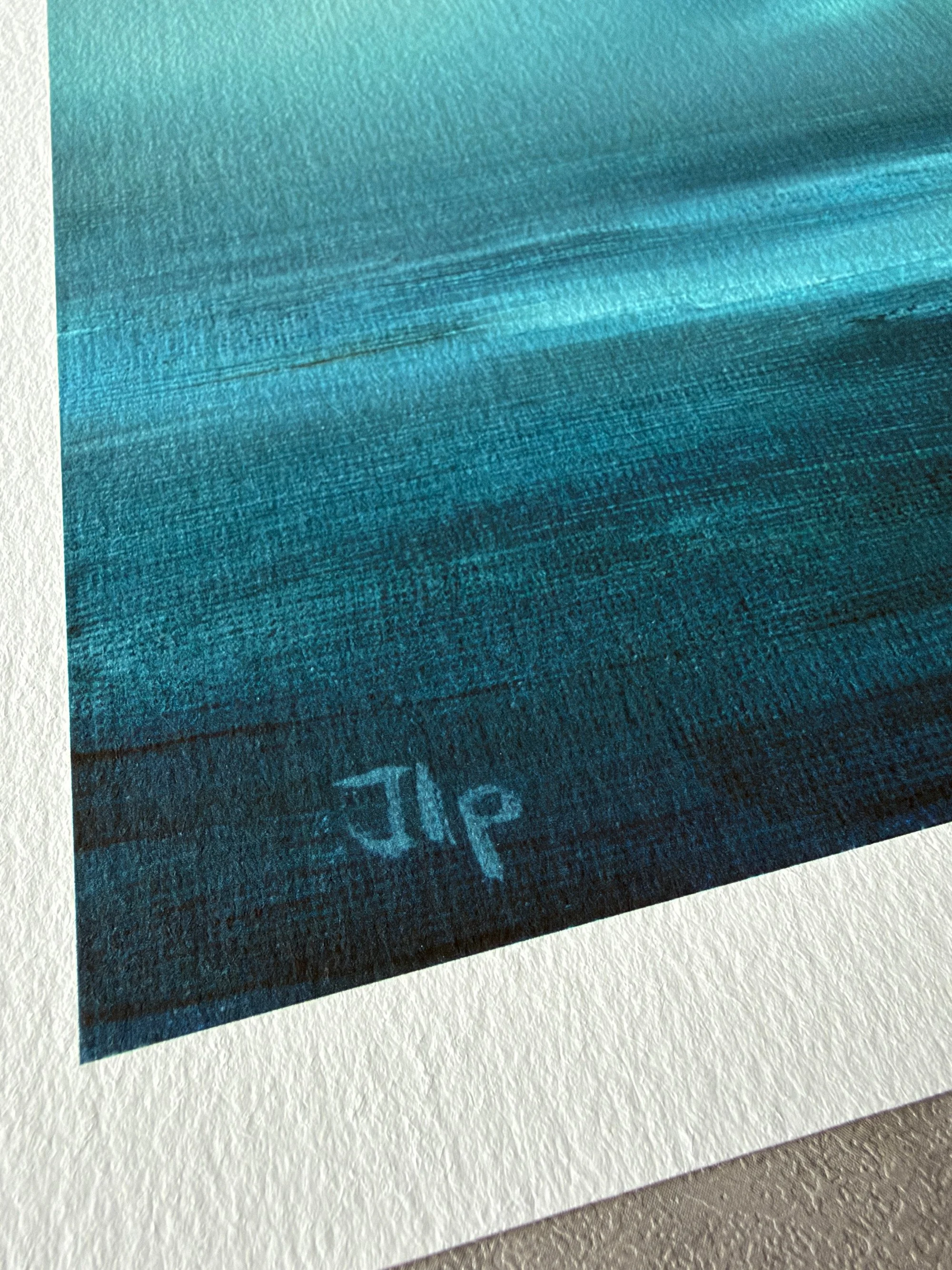 Close-up of the reproduced JLP signature and white textured paper border on the Ocean Light fine art print.