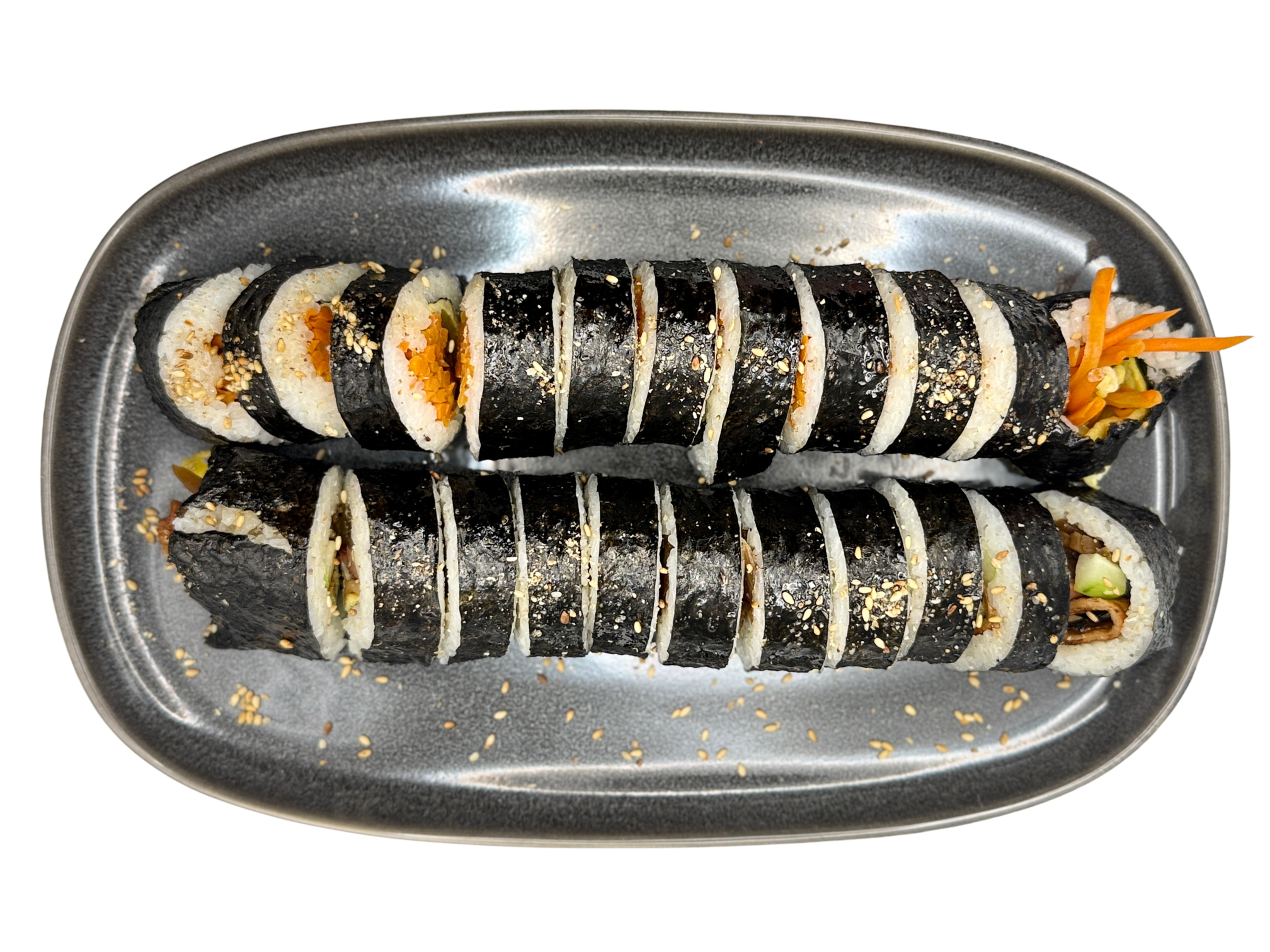 Sliced seaweed-wrapped kimbap rolls on a gray plate, garnished with sesame seeds and shredded carrots and cucumbers.