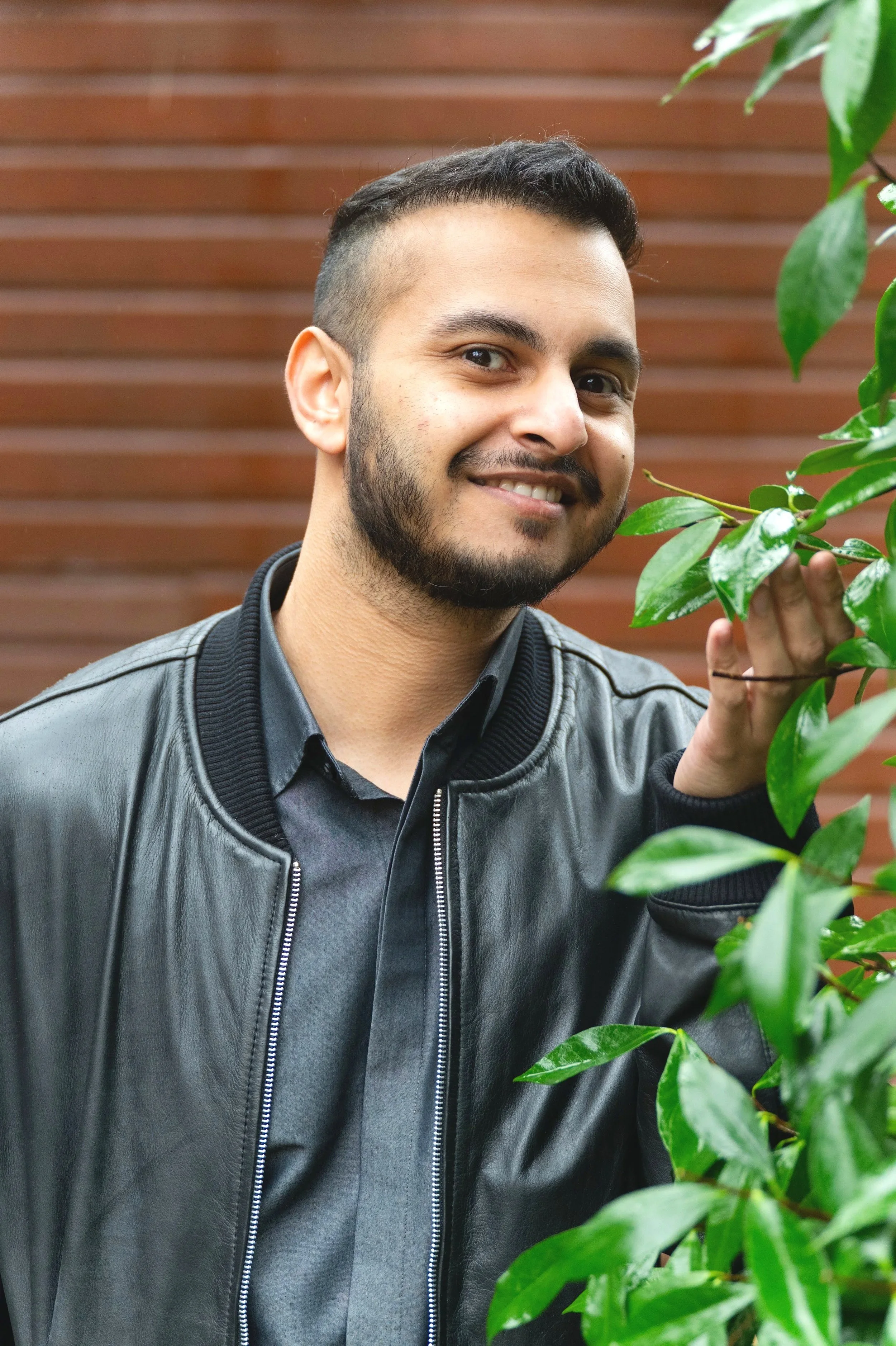 a man touching leaves