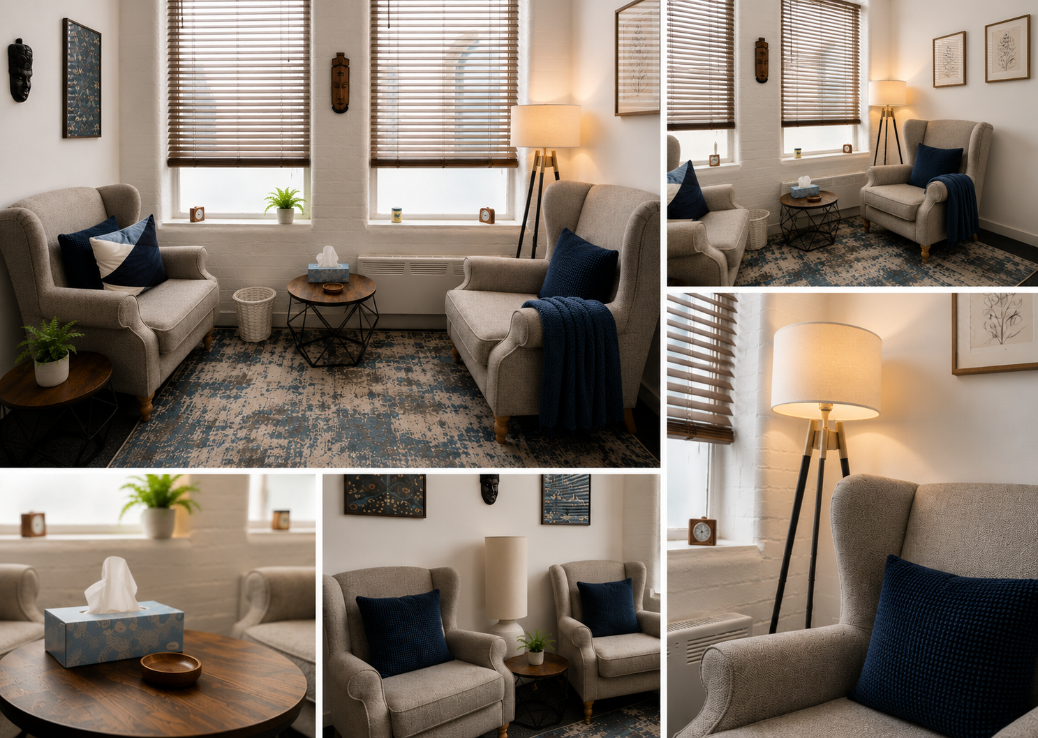 Cozy living room with two beige armchairs, blue pillows, wooden side tables, a floor lamp, and artwork on the walls. Windows have wooden blinds, and the room features a patterned rug and some decorative items.