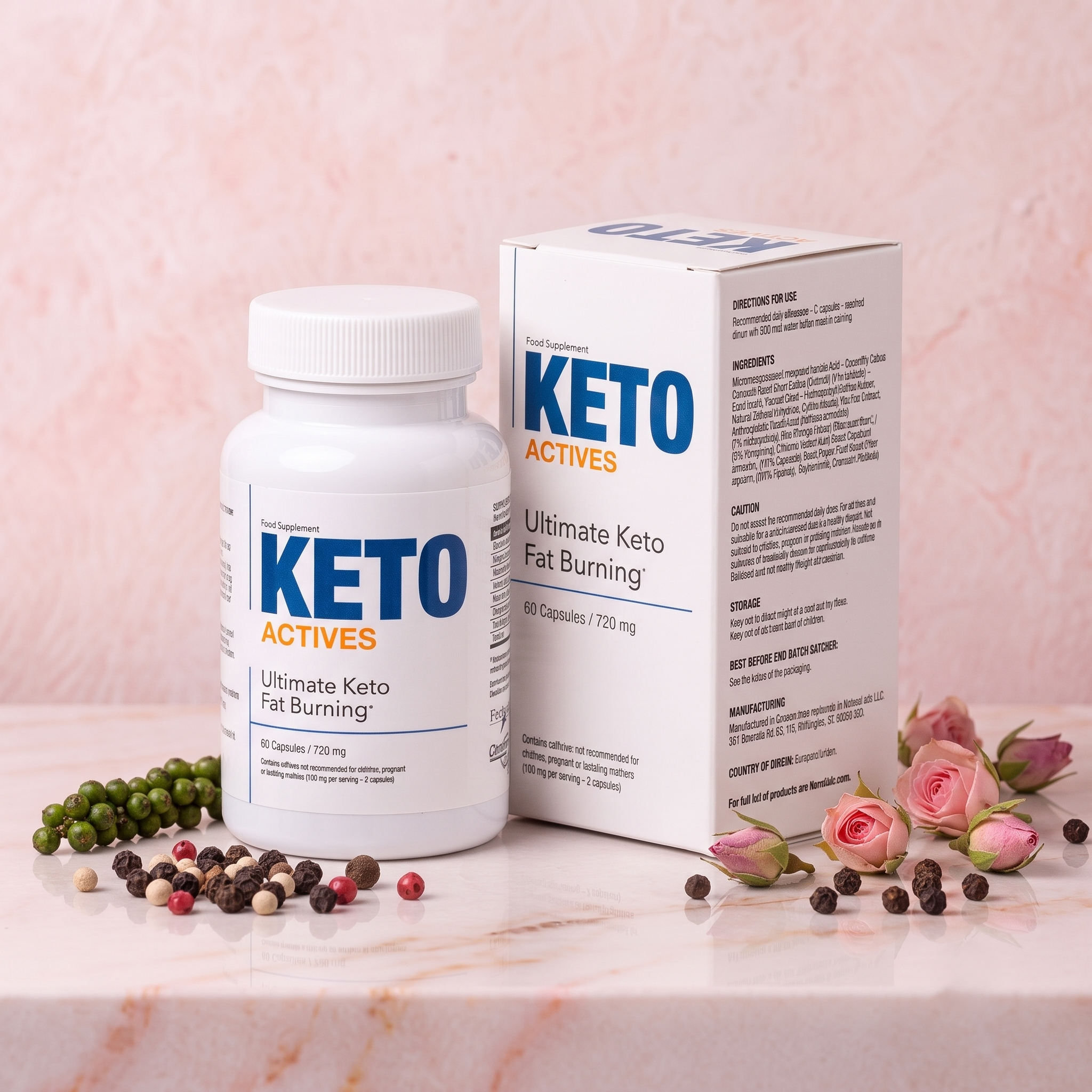 A bottle of keto supplement pills and its box standing on a pink marble surface surrounded by pink roses and multicolored peppercorns, with a soft pink marble background.