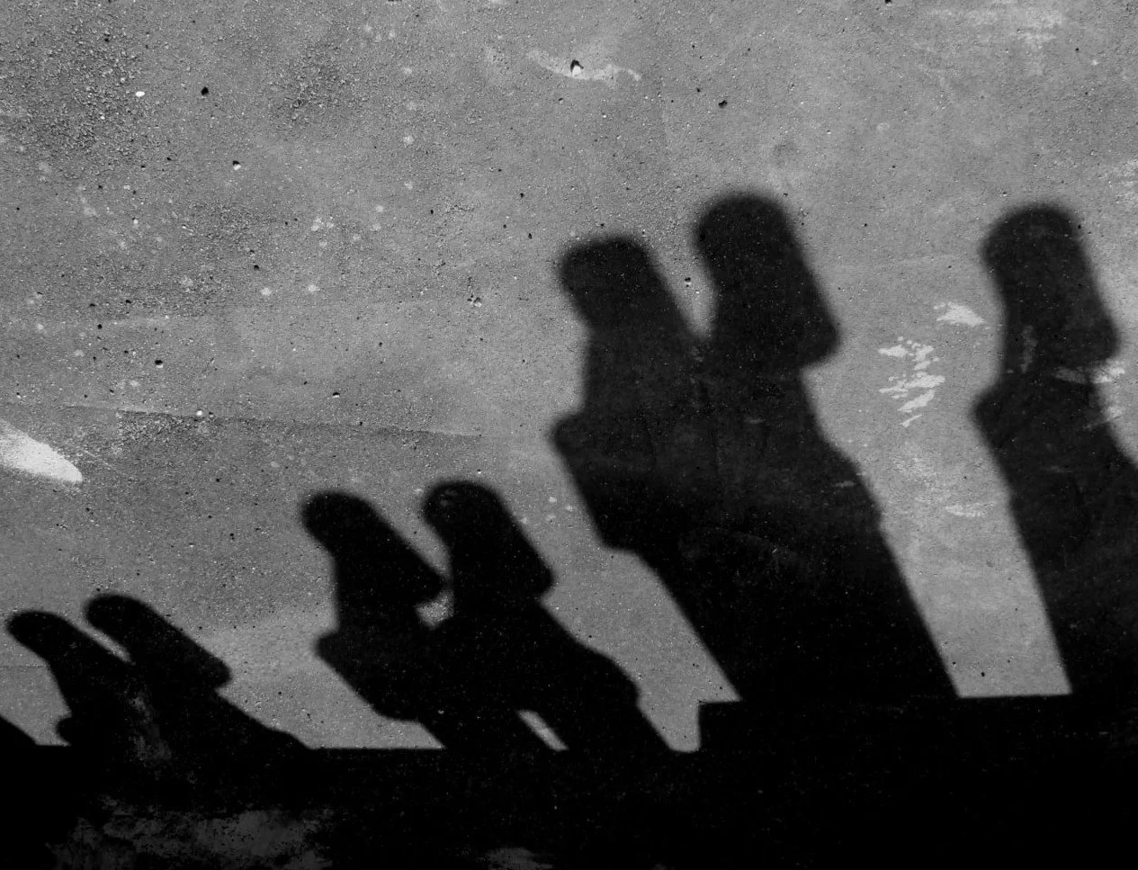 Every shadow is the memory of a body already elsewhere. Photography does not preserve presence; it preserves its disappearance. What the eye encounters is neither person nor absence, but the silent interval where identity dissolves into light, and me