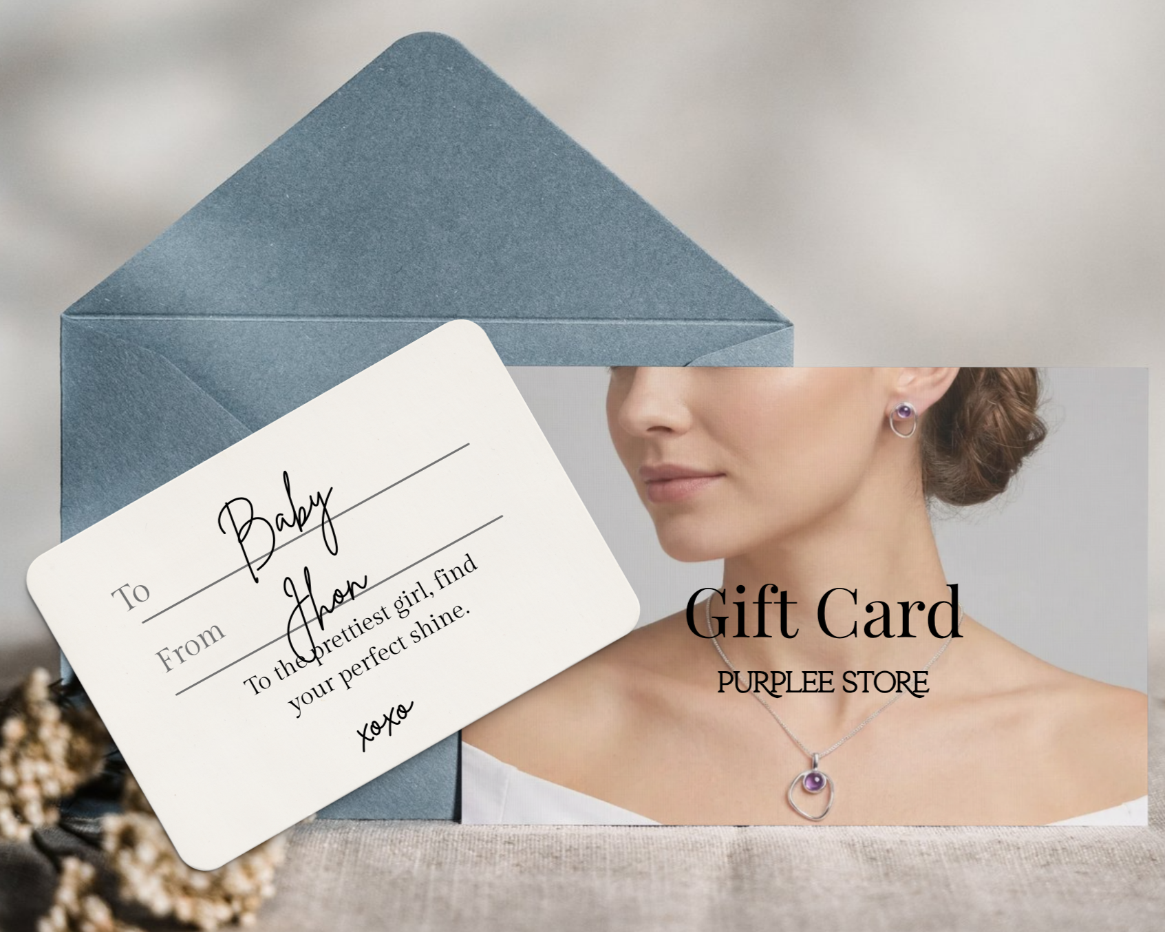 A luxury physical gift card from Purplee Store with a romantic handwritten note next to a blue envelope, showcasing a model wearing a fine gold necklace and earring set.