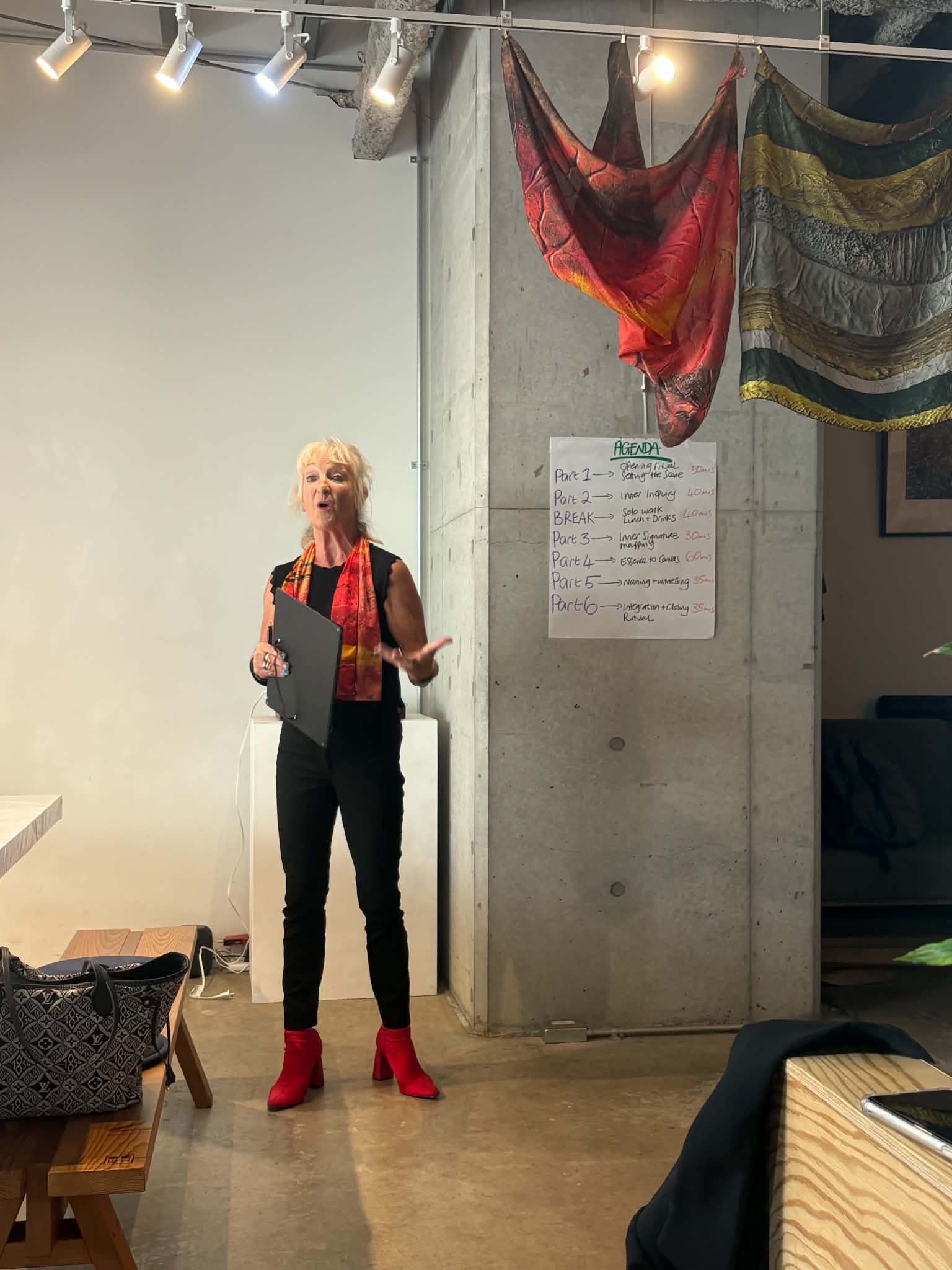 woman facilitating a workshop featuring silk scarf