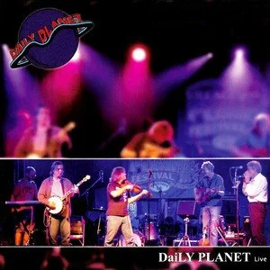 A live band performs on stage with colorful lights and a backdrop banner at an event.