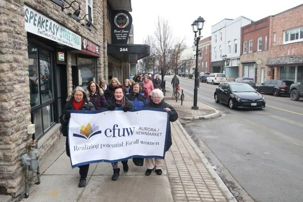 IWD 2026 - Street walk with banner.jpg