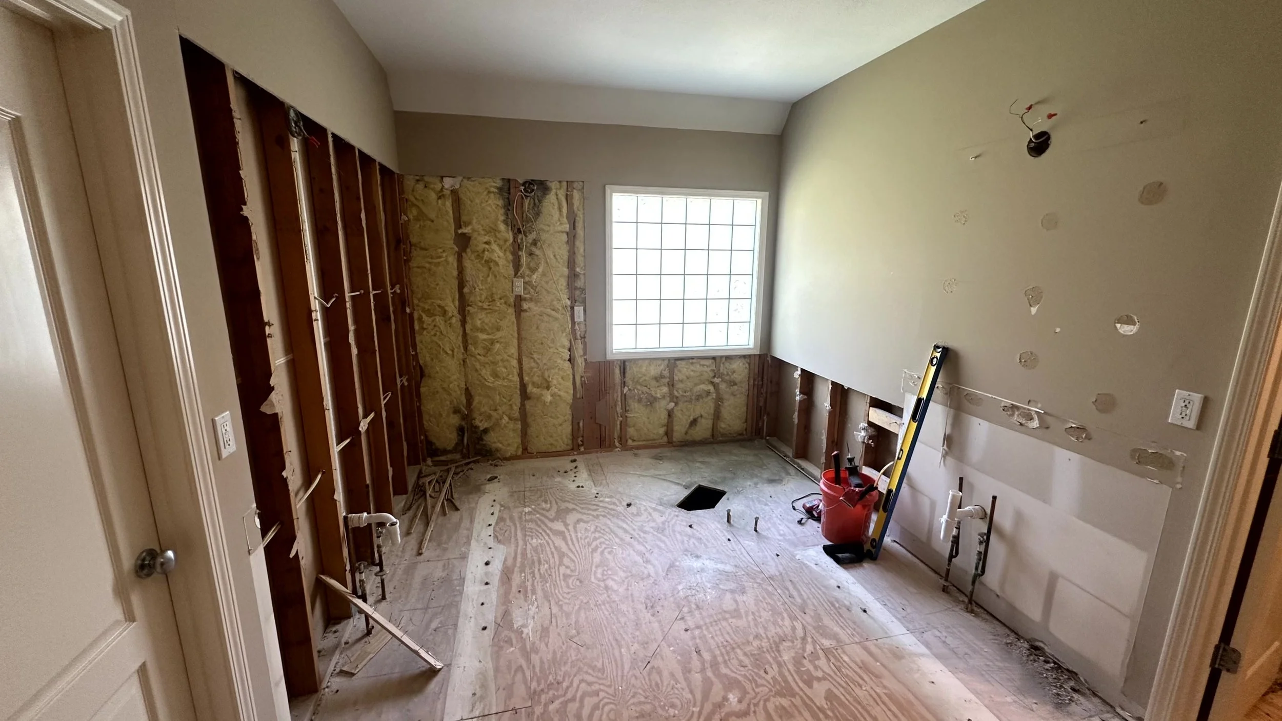 A bathroom that has everything removed by a general contractor in Overland Park.