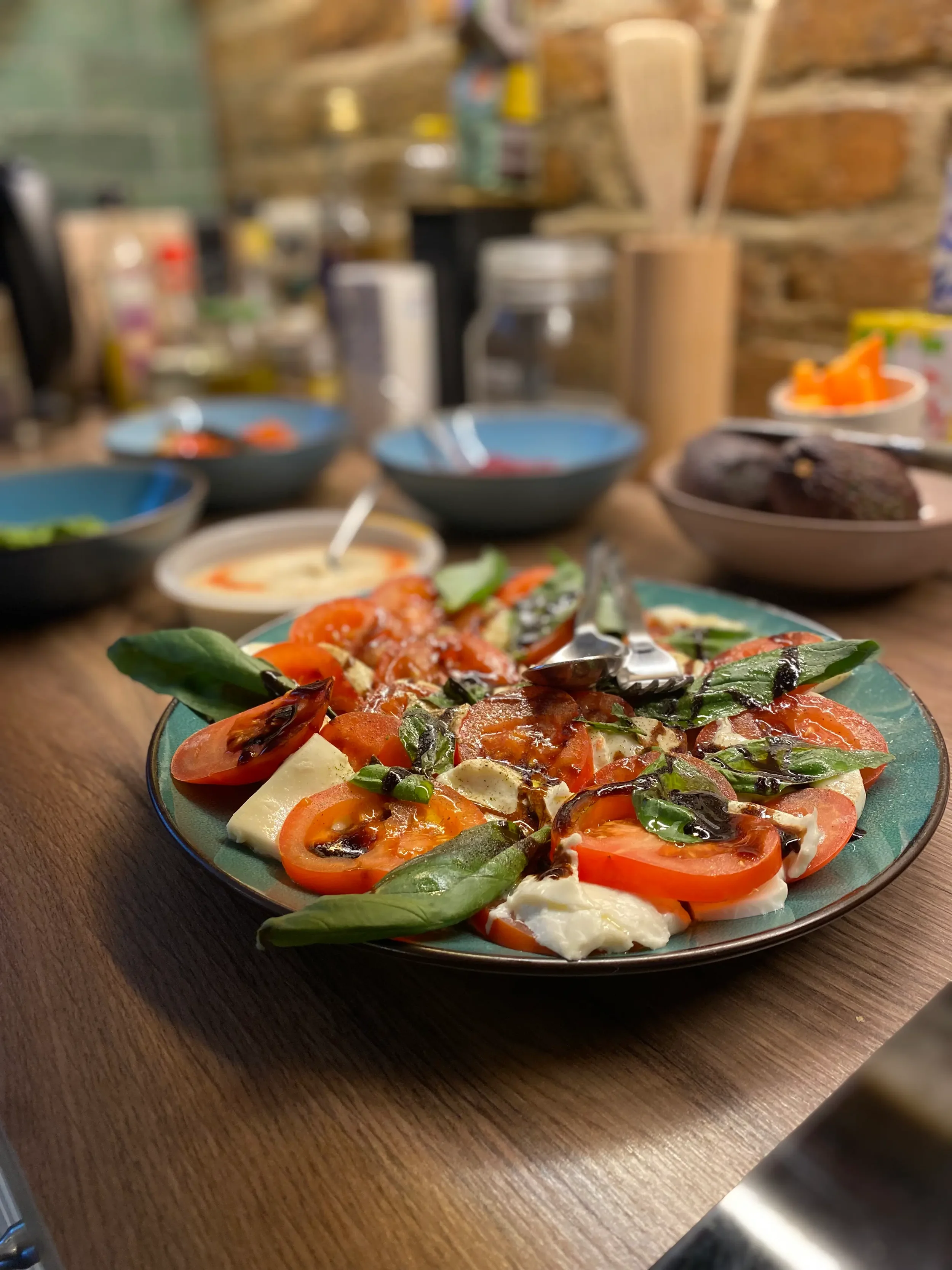 Fresh vegetarian meal with tomatoes, mozzarella and basil prepared for guests during a yoga retreat.