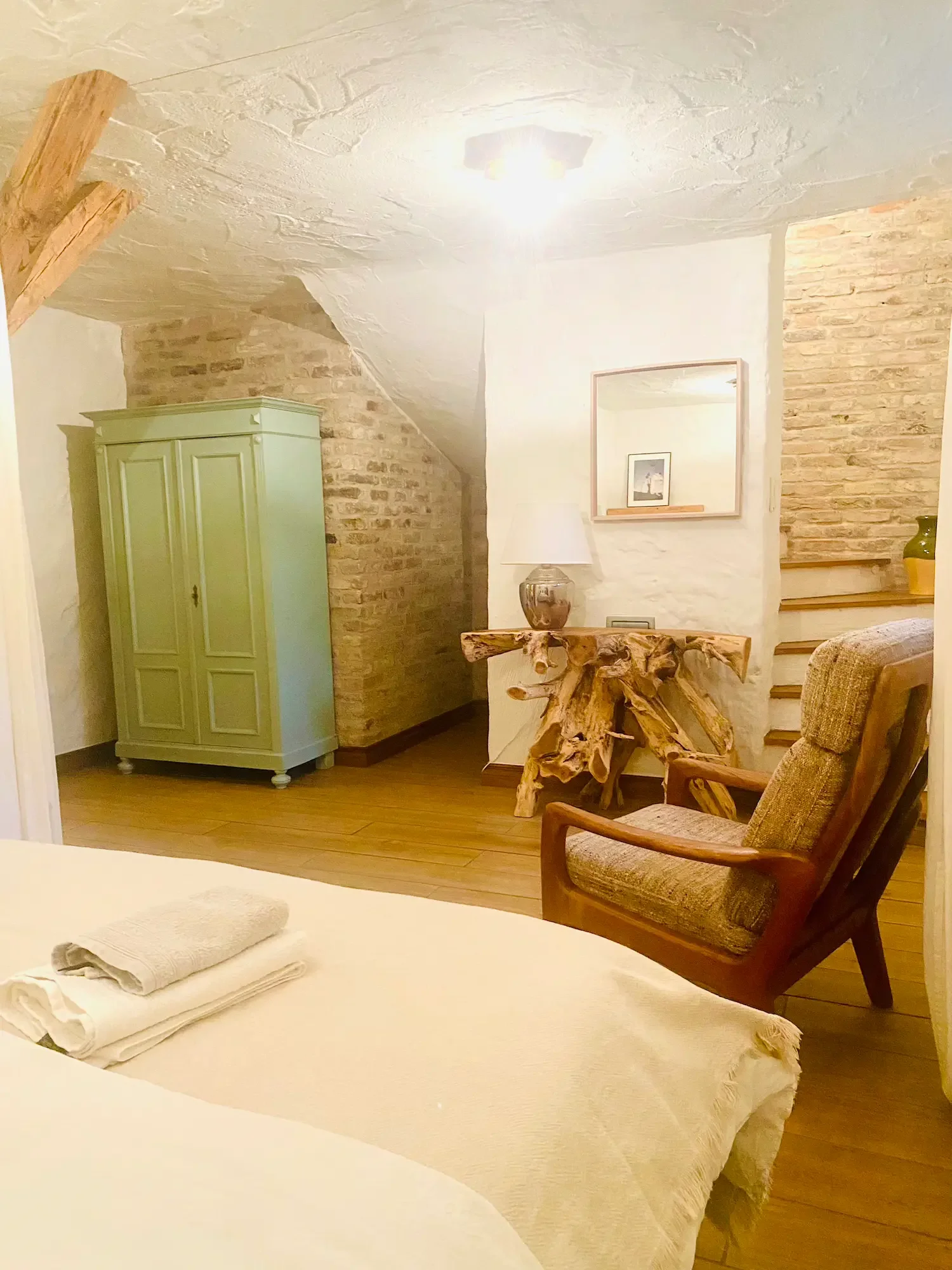 “Cozy bedroom at a yoga retreat in Brandenburg near Berlin, offering peaceful accommodation surrounded by nature