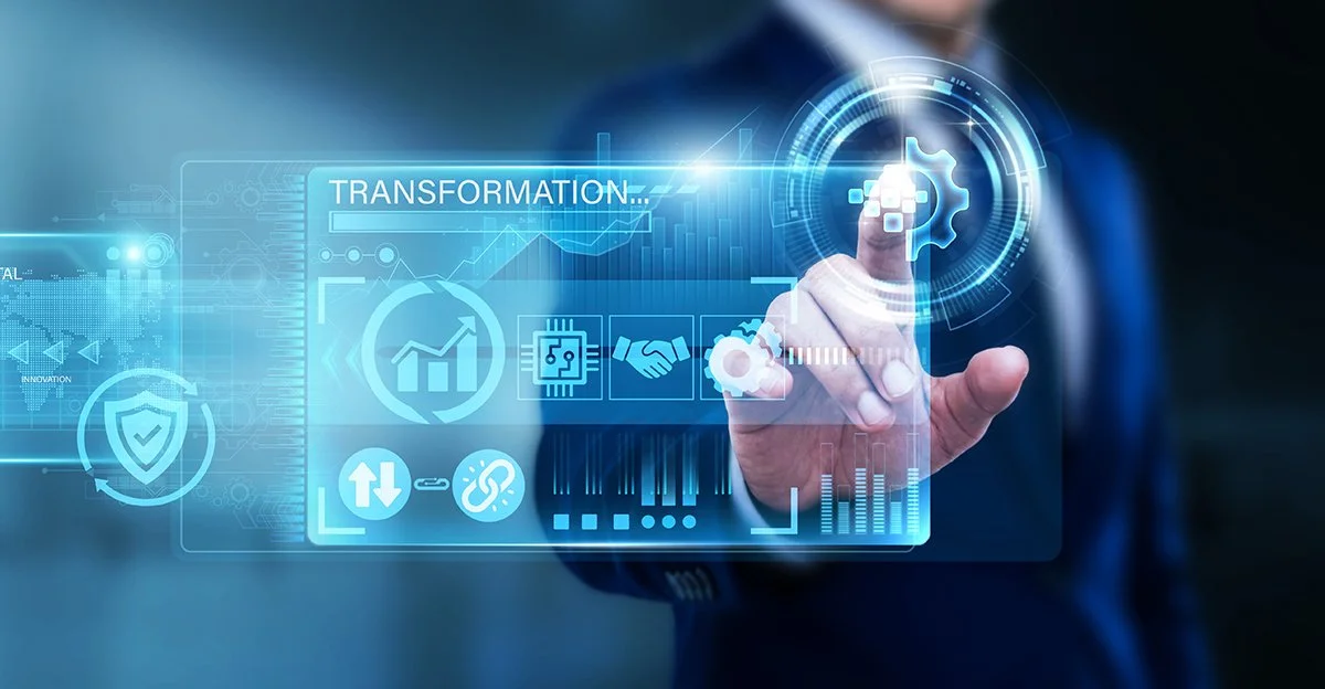 Person in suit interacting with a digital interface displaying human resources, data analysis, and technology icons with the word "Transformation".
