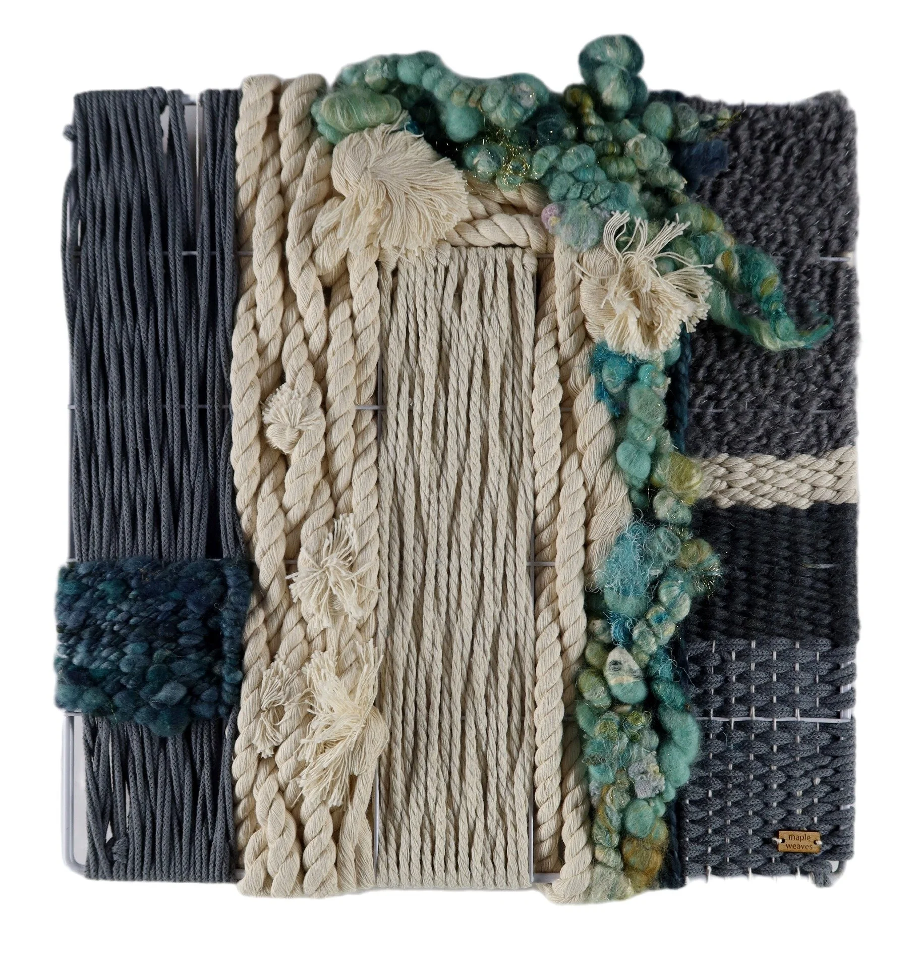 "Sea Glass", Handwoven (Wool, handspun yarn, cotton). Mounted in a 14" x 14" metal frame.  $350