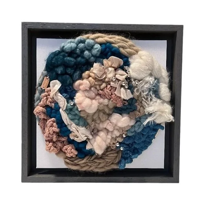 "Tide Pool", Handwoven (Wool, cotton and sari silk). Mounted in a 9.75" x 9.75" charcoal gray wooden frame without glass.  $250