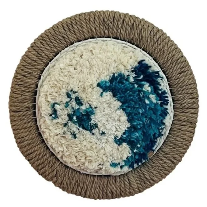 "Quiet Reflections", Handwoven (Wool and cotton). Mounted in a jute floral ring, 15" diameter.  $350