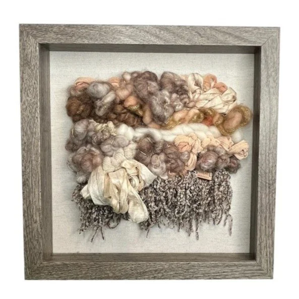 "Softly Held", Handwoven (Wool, handspun yarn, cotton, sari silk). Mounted in a 10" x 10" brown wooden frame without glass.  $160