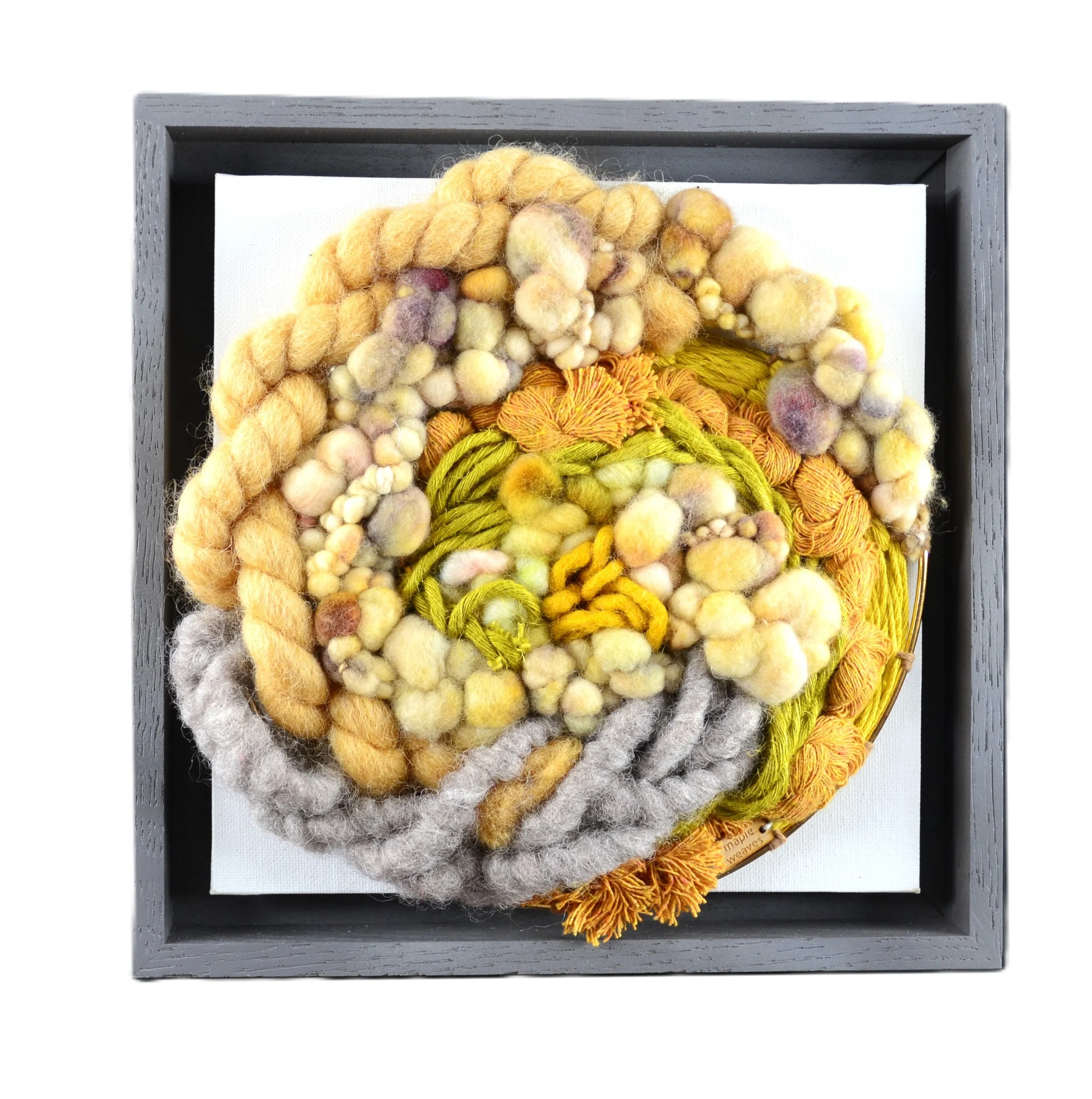 "Coral Reef", Handwoven (Wool, handspun yarn and cotton). Mounted in a 9.75" x 9.75" charcoal gray wooden frame without glass.  $250