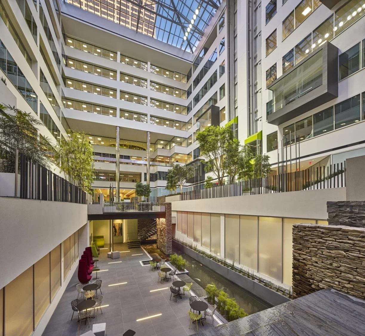 Modern multi-storey commercial atrium illustrating a complex refurbishment and construction environment.