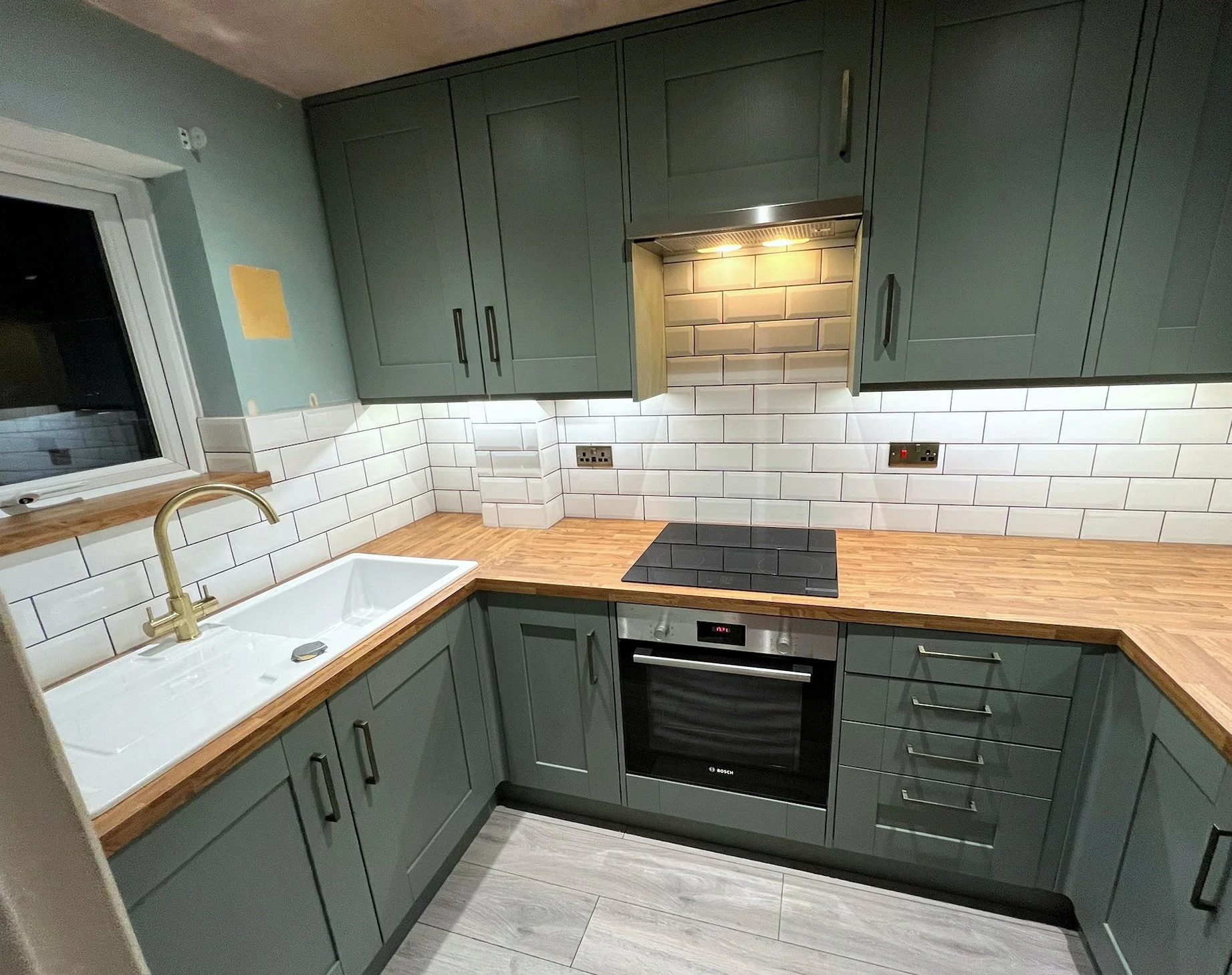 Contemporary Kitchen instalment. New units, worktops and tiles.