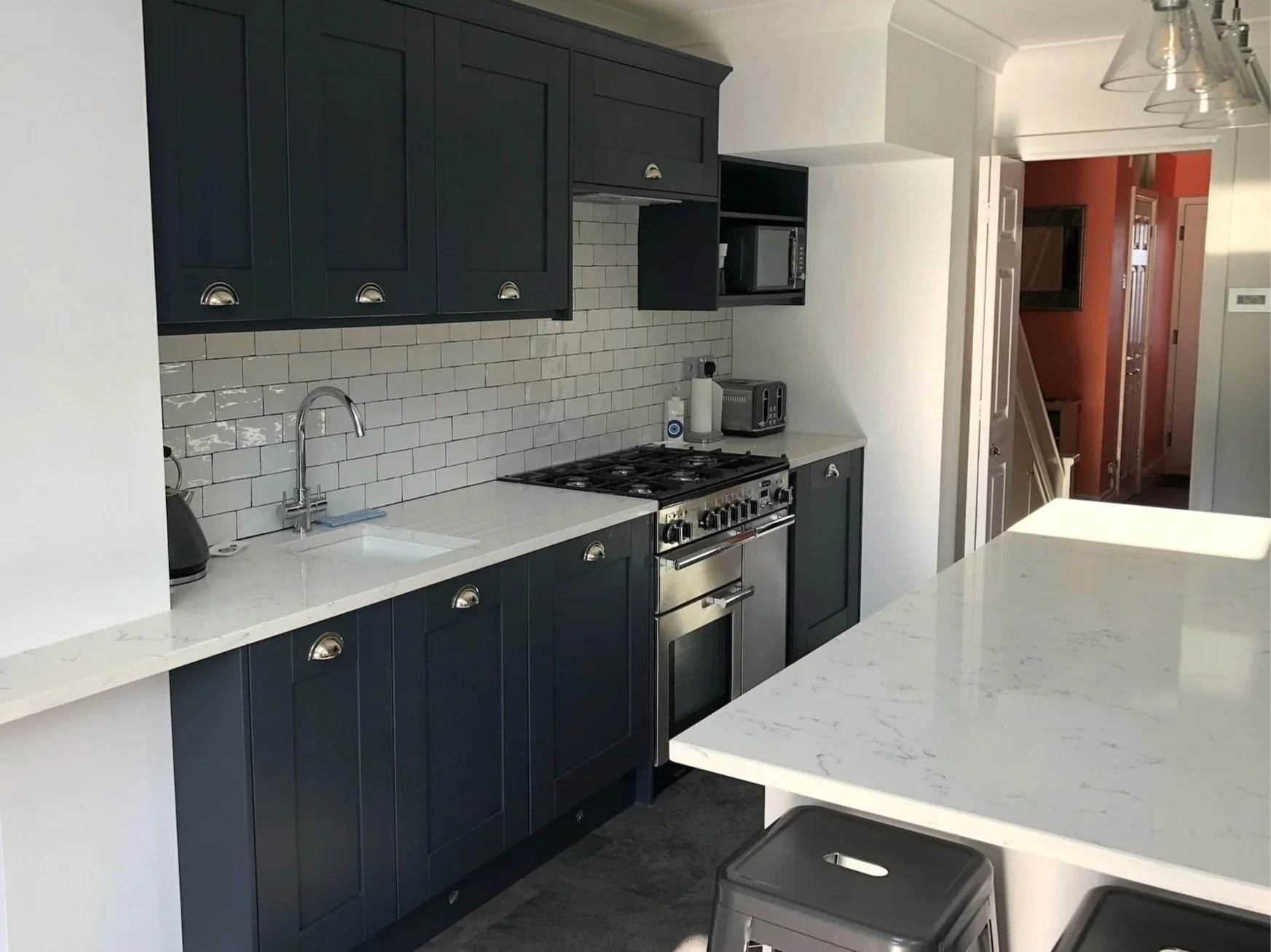 Completed modern kitchen installation ready for handover following final quality checks and clean-up.