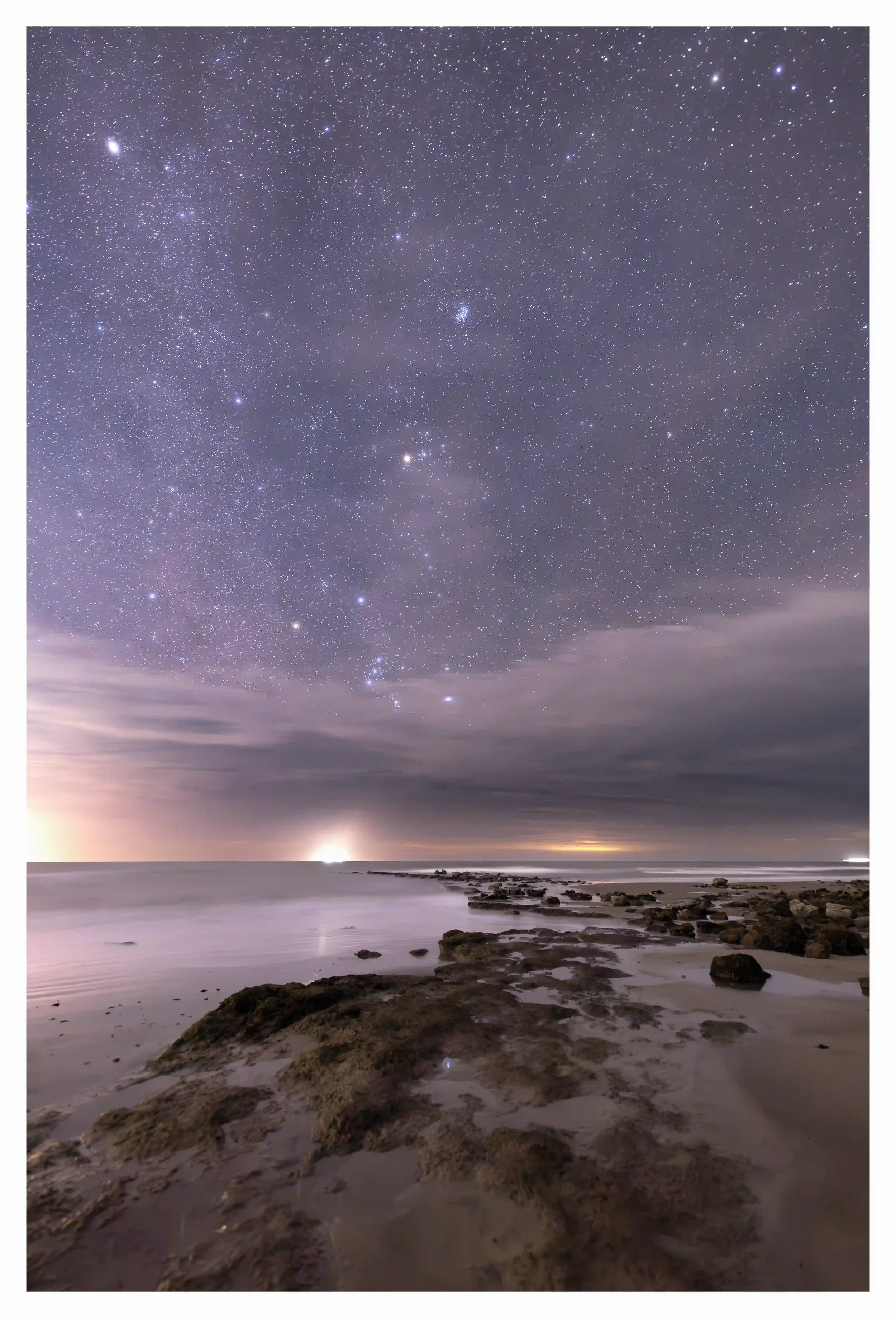 TEMPORAL GUIDANCE
Rocks that only shortly show themselves at low tide, appearing like a temporary path leading to the openness of the sea. As I stood and followed the rocks with my eyes only to also notice that clouds had allowed the rising Orion con