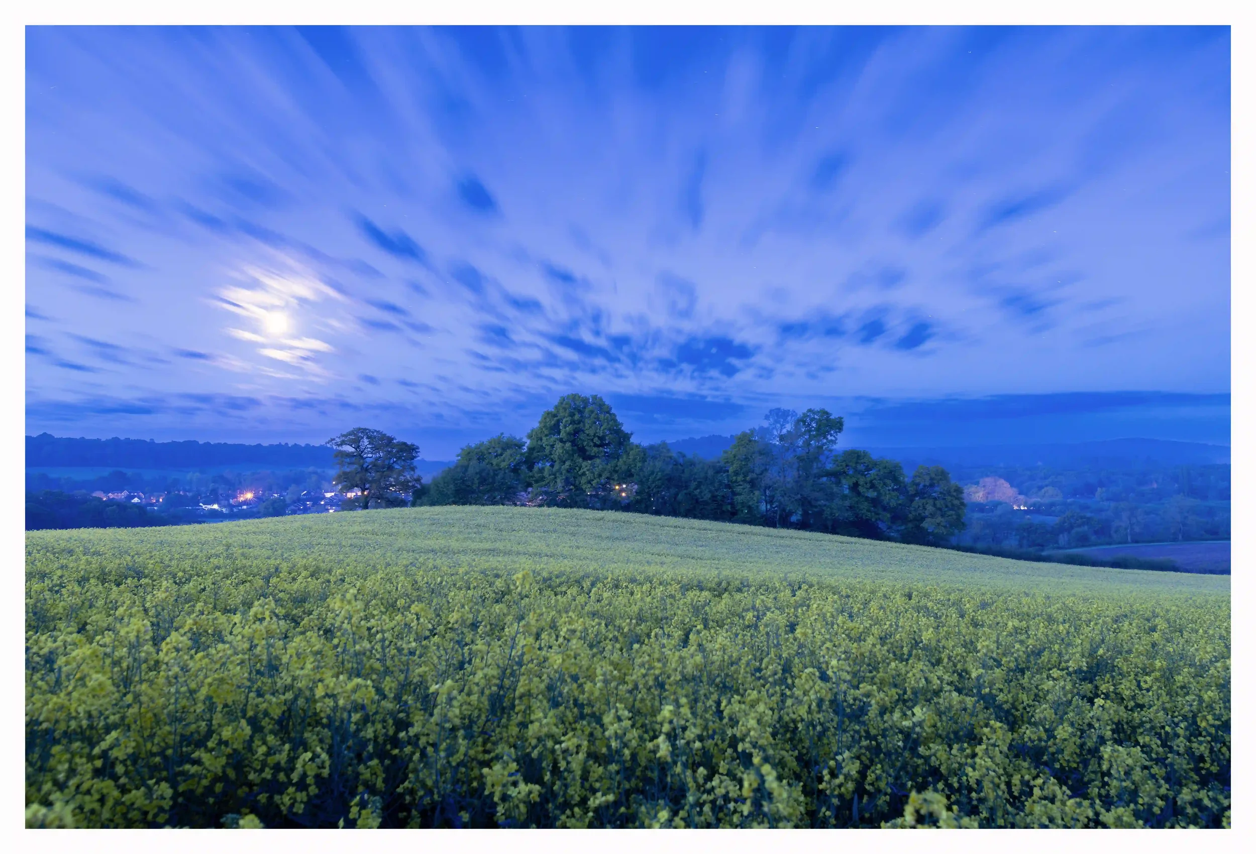 ENTRANCED UNDER MOON LIGHT
Chantry Woods, Guildford, Surrey, UK. 
A night when the whole atmosphere upon and surrounding the gorgeous rolling yellow moonlit field just seemed to make me feel so at peace. It felt like I was in a completely temporary s