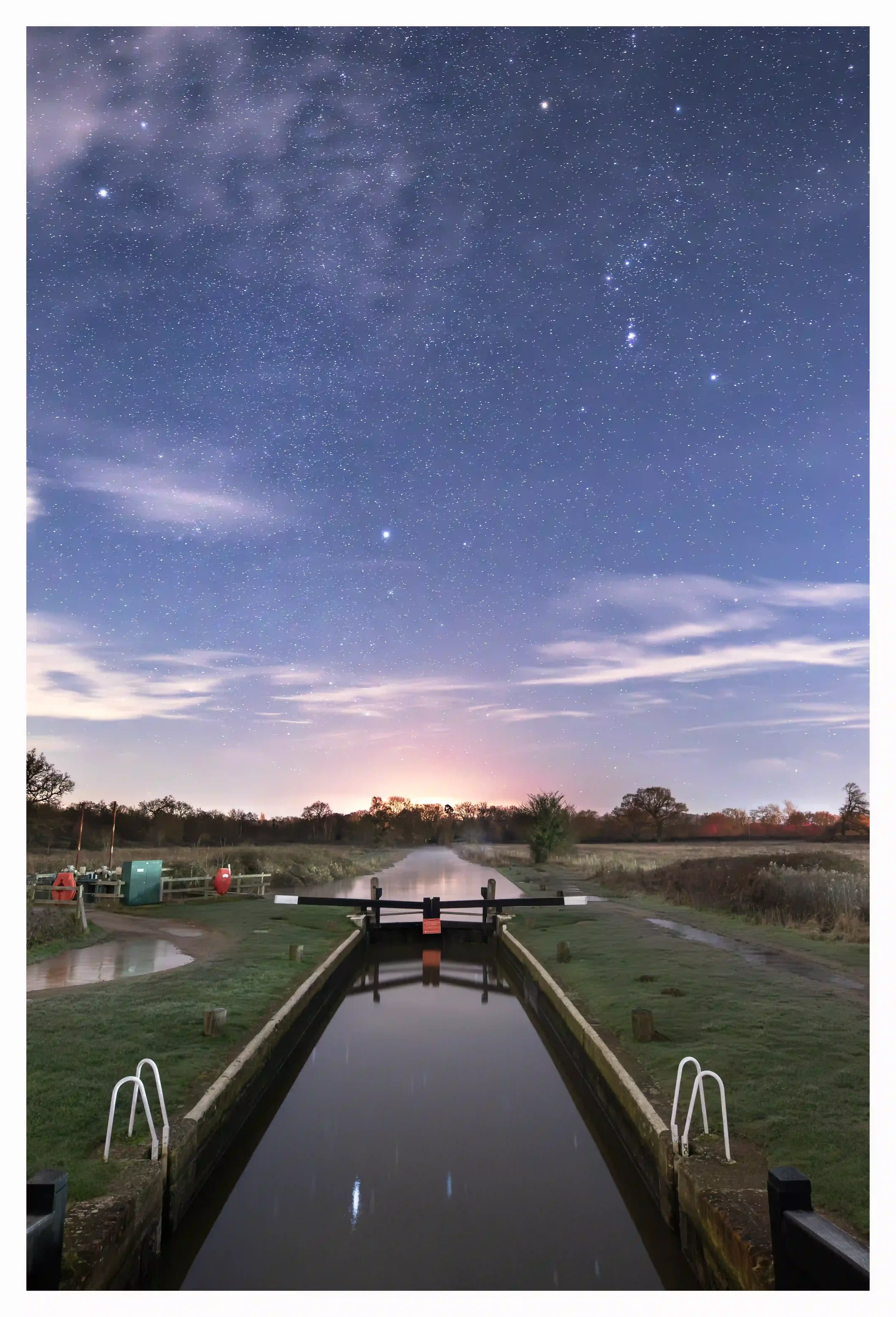 REMAINING WATCHFUL
St Catherines Lock, Guildford, Surrey, UK.
A river that had recently been on high flood alert as the forces of nature reminded us of its power. On this night clouds decided to temporarily break up allowing me to also look up at the