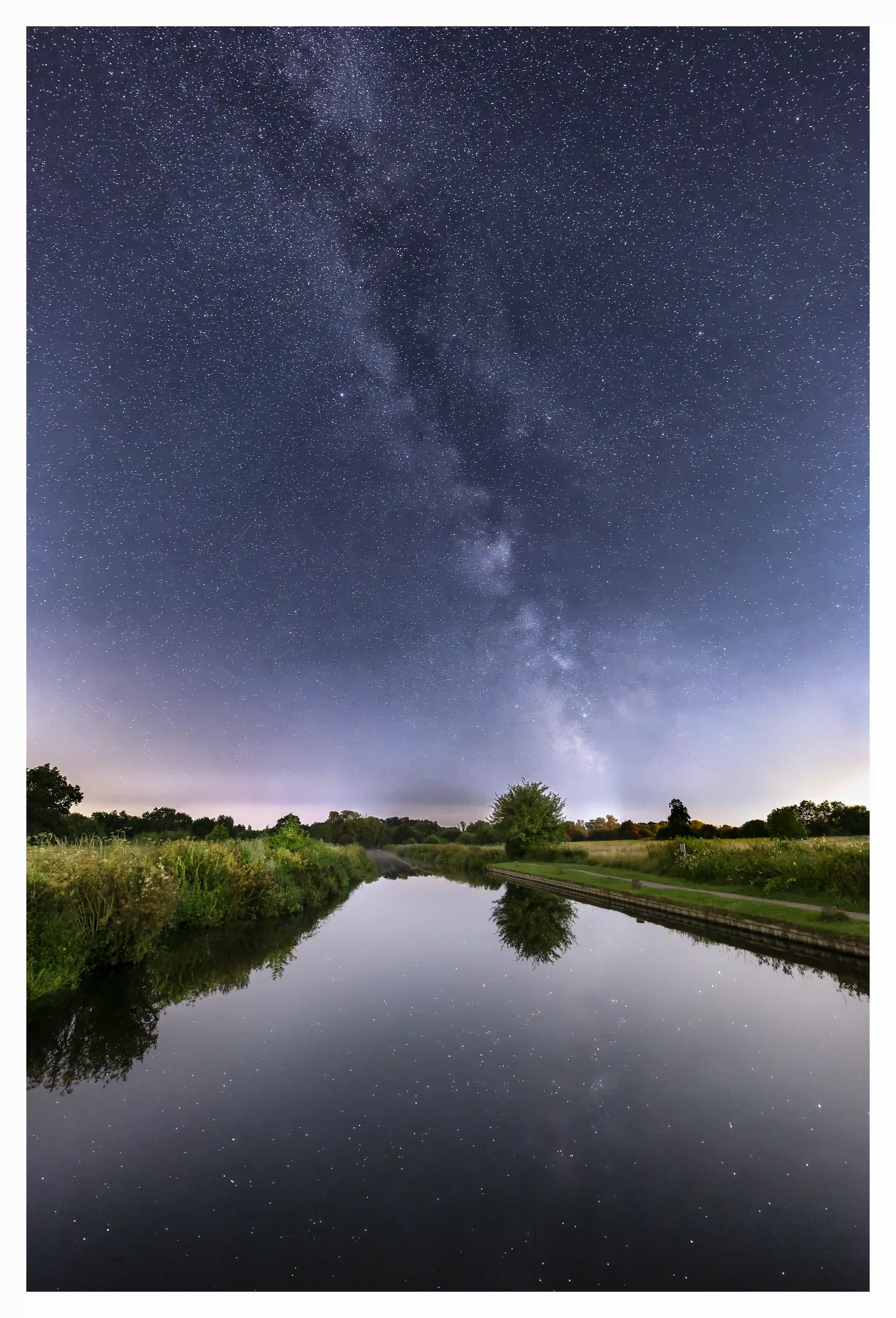 RIVER WEY TRANQUILITY
St Catherines Lock, Guildford, Surrey, UK.
I could never get bored with just how soothing it can be under a cloudless sky on a warm summer’s night. Despite surrounded by so many urban lit towns and estates; being out long enough