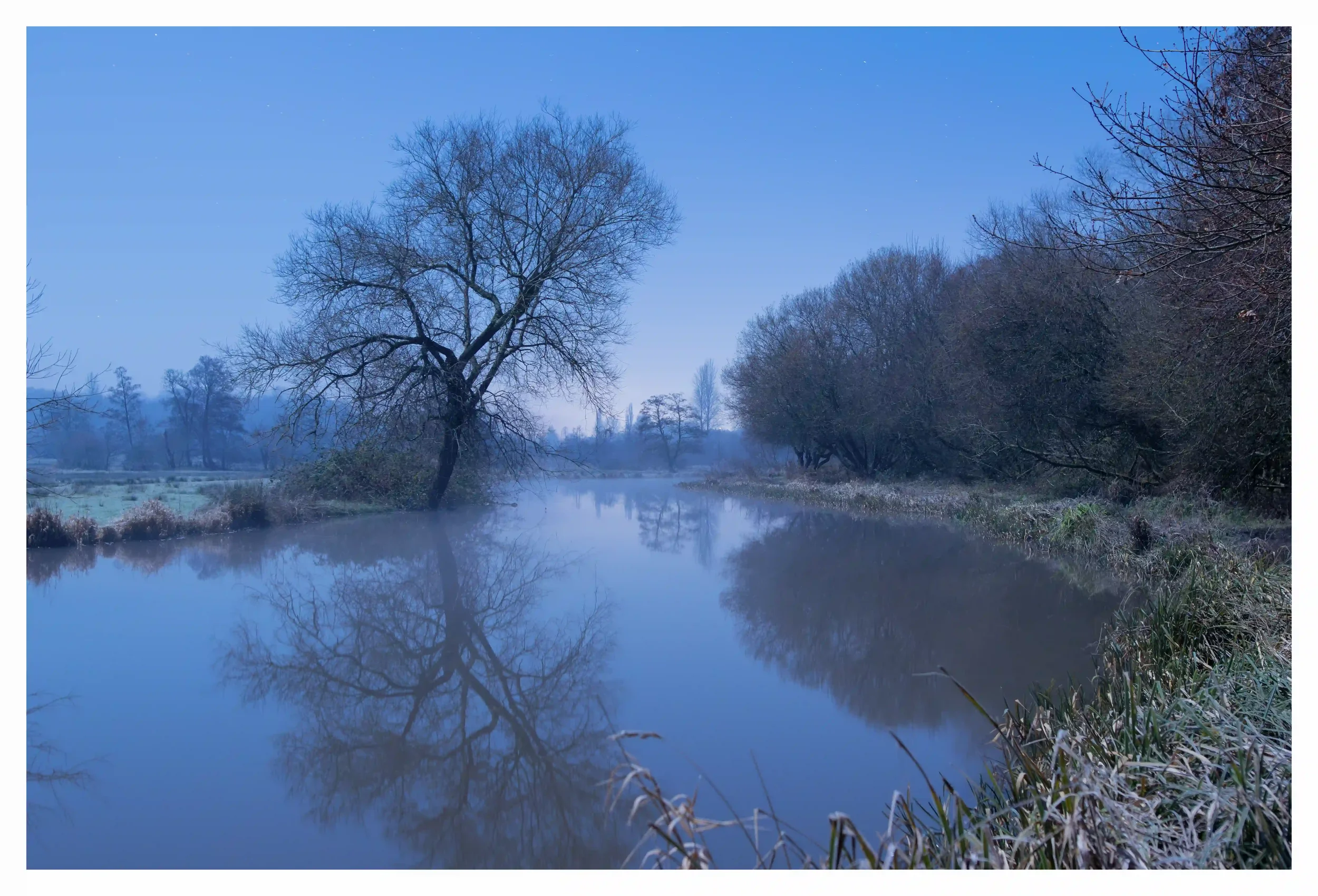 MEANDERING SOFTLY
River Wey, Godalming, Surrey, UK.
A cold and crisp winters night, as temperatures dropped rapidly to minus figures on this clear moonlit night along the River Wey. There was just something so refreshing and tranquil as I stood by wa