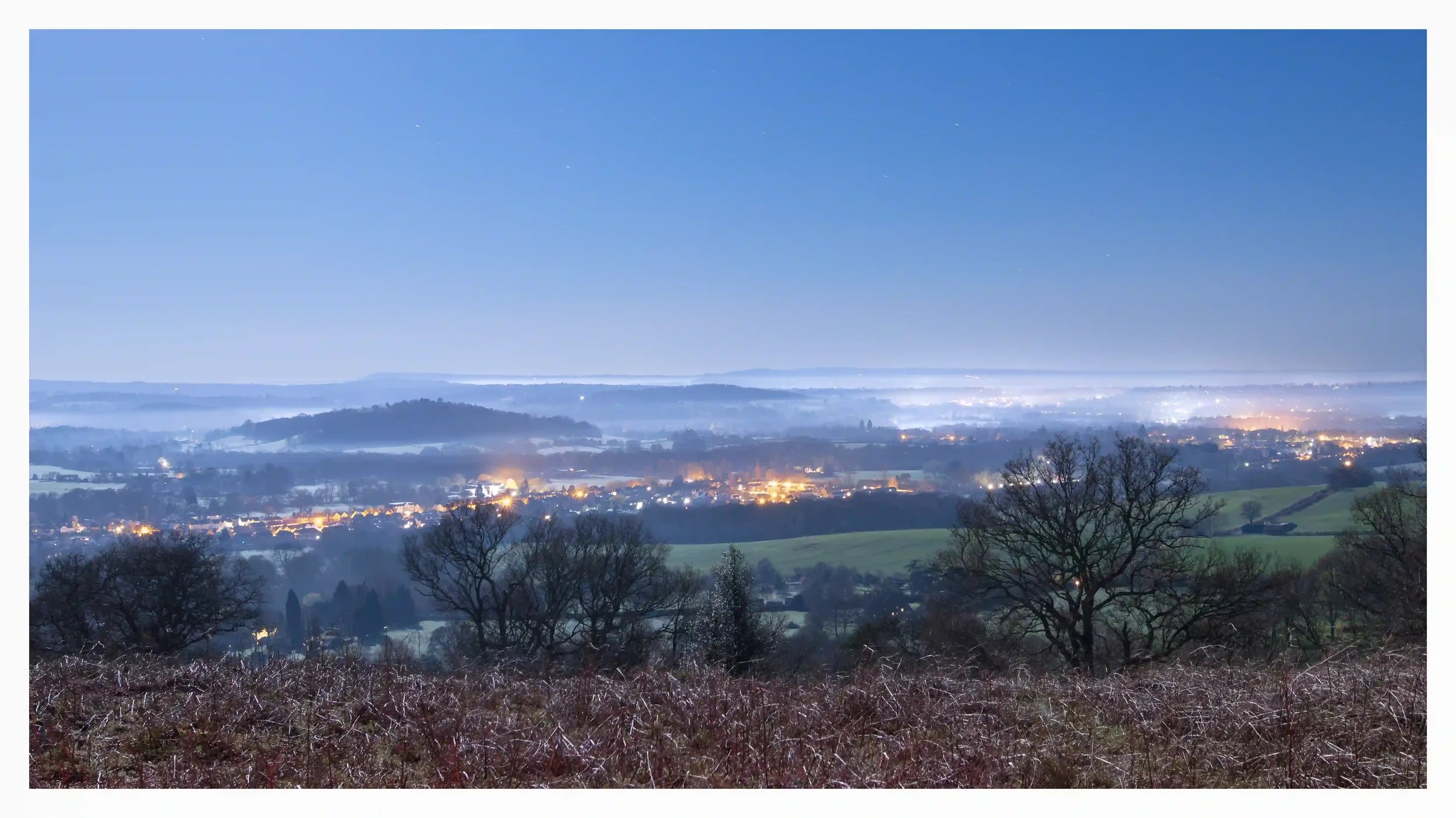 St MARTHAS HILL STILLNESS OF THE NIGHT
St Marthas Hill, Guildford, Surrey, UK.
The rolling hills of Surrey can have such an amazing way of portraying peace and tranquillity. On this fresh moonlit night, as most of the town was sleeping; I stood feeli