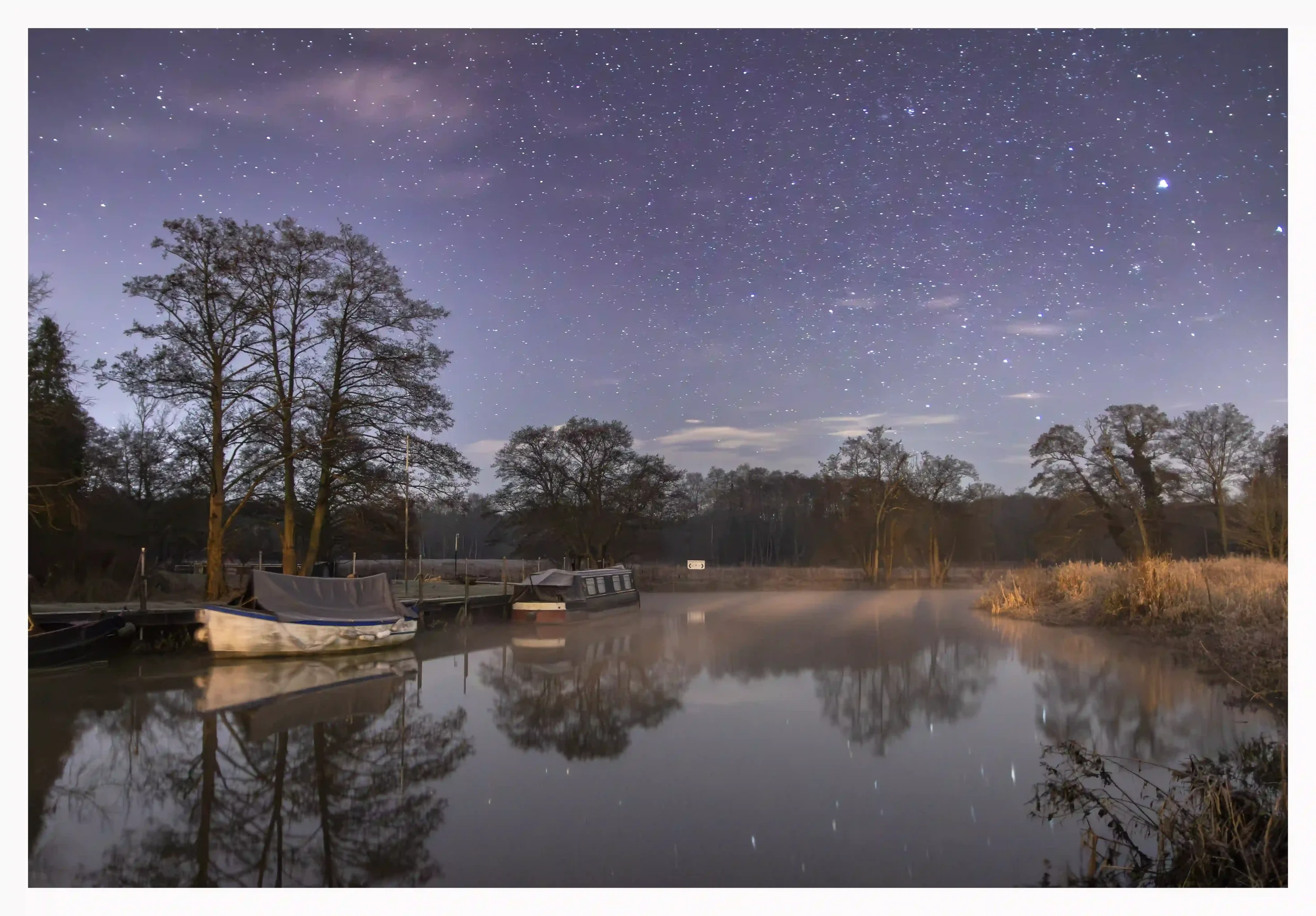 RIVER WEY NIGHT SERENITY
River Wey, Broadford Bridge, Shalford, Surrey, UK.
On this fresh and cold night, the neighbouring industrial lights seem to warmly glow the banks of river. Being so late; most of the town was asleep as not even many cars pass