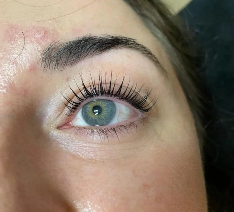 Close-up of a person's eye post lash lift and tint treatment.
