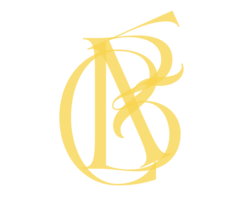 A gold-colored ornate monogram with the letters B and D intertwined on a white background.