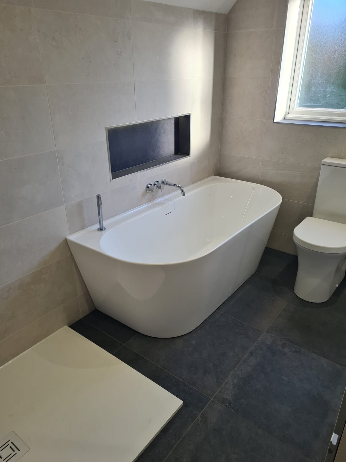 Bathroom Installation with tiling and electrical work.