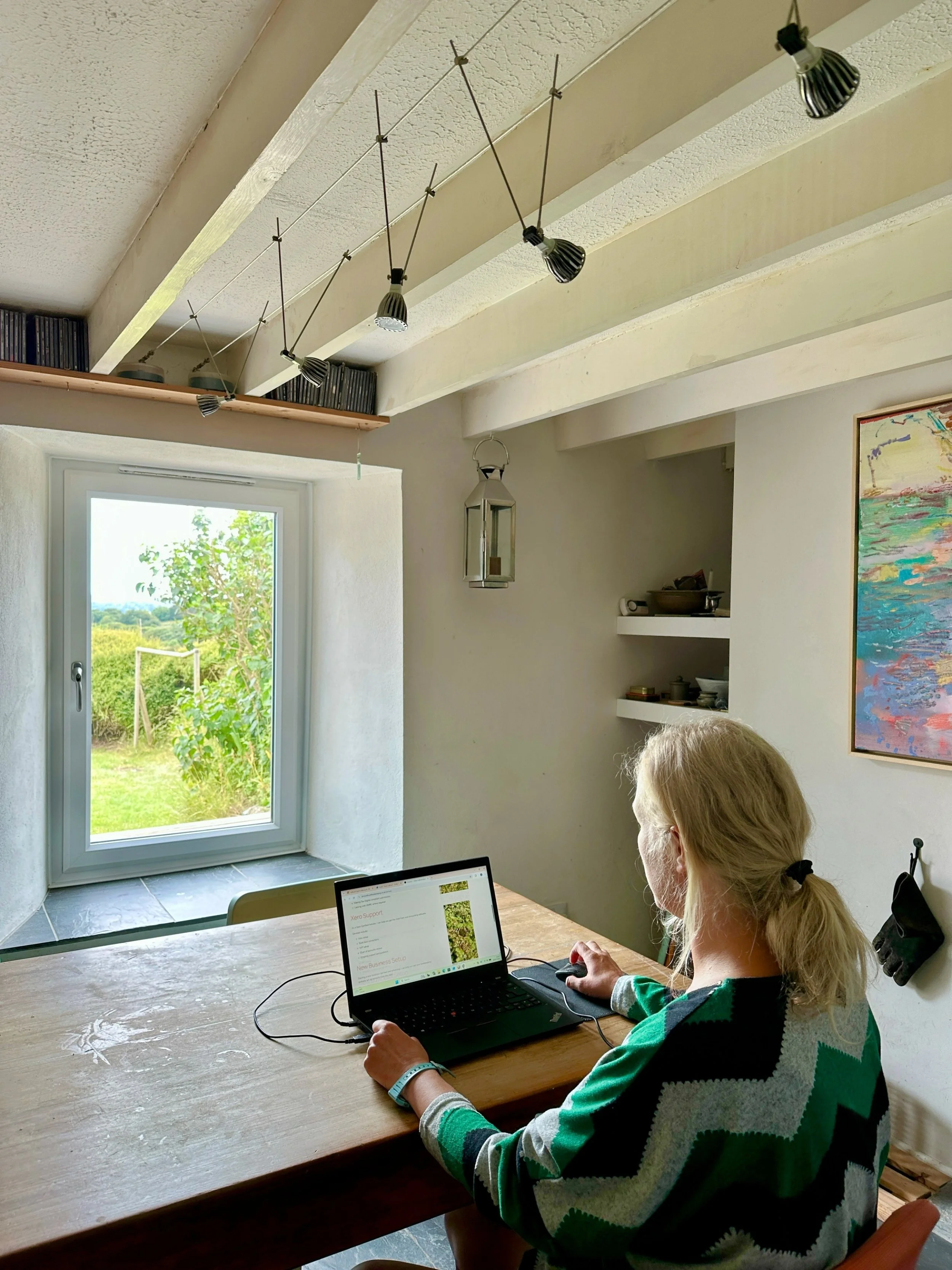 Anna Cathcart providing bookkeeping services for small businesses from her home office.