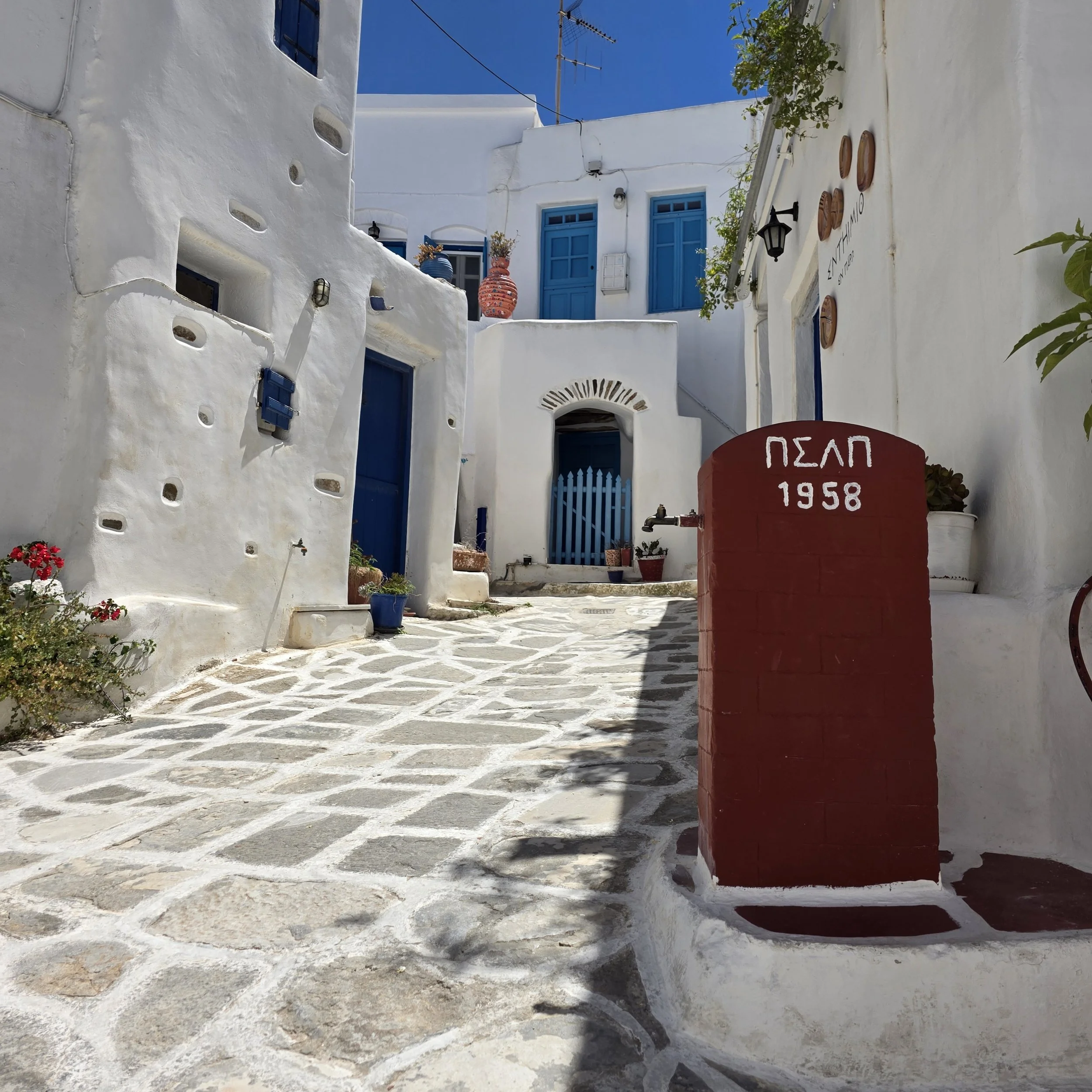 Whitewashed village streets and harbor in Paros, Greece