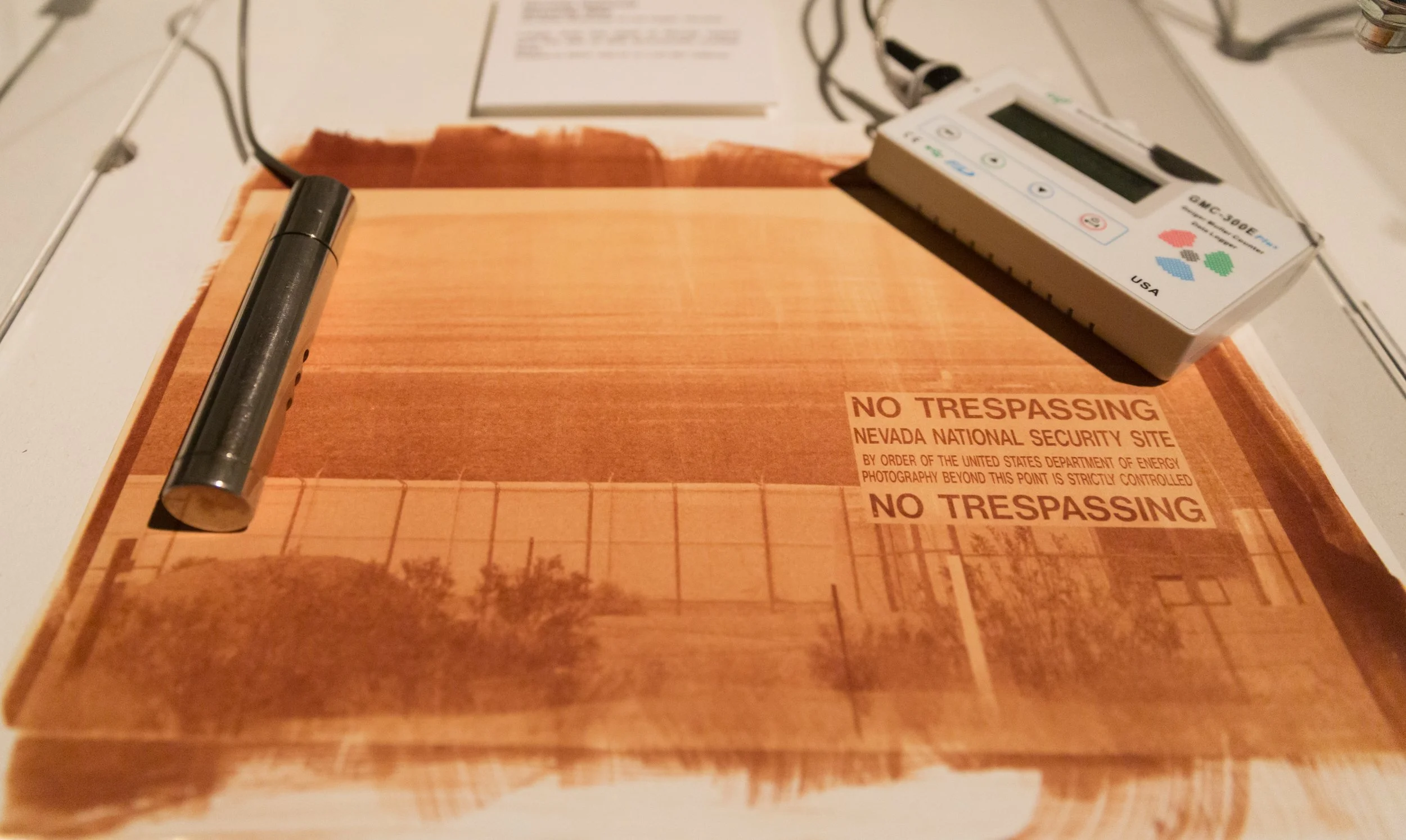 Nevada National Security Site, Outside of Las Vegas, Nevada Radioactive waste shipped to WIPP: 107,087, Pedestal with 2 Geiger Counters on top of a uranotype in a locked box, speaker.