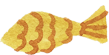 A yellow fish-shaped pastry with red decorative scales.