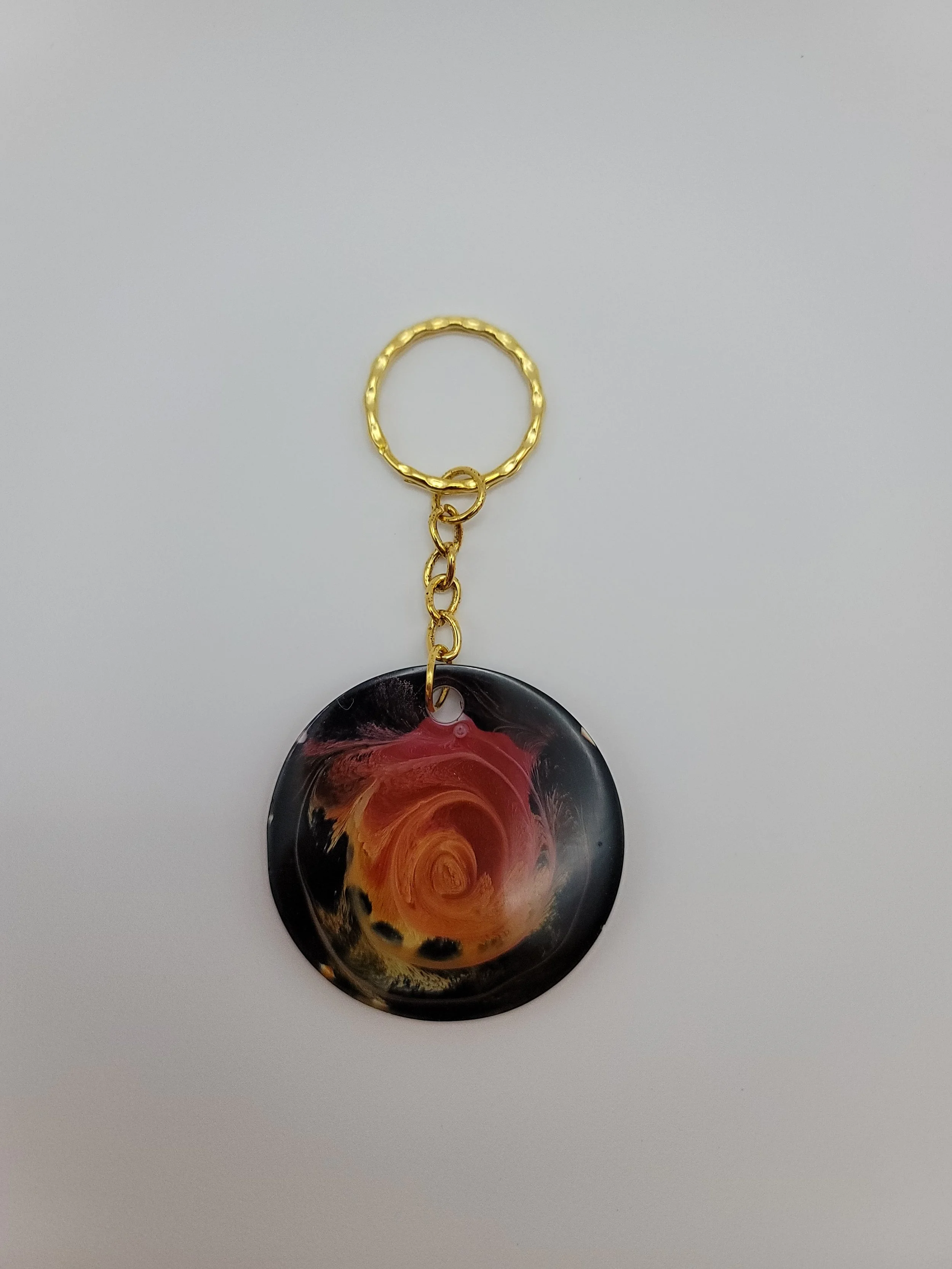 Black, Red, Orange, & Yellow Circular Keychain