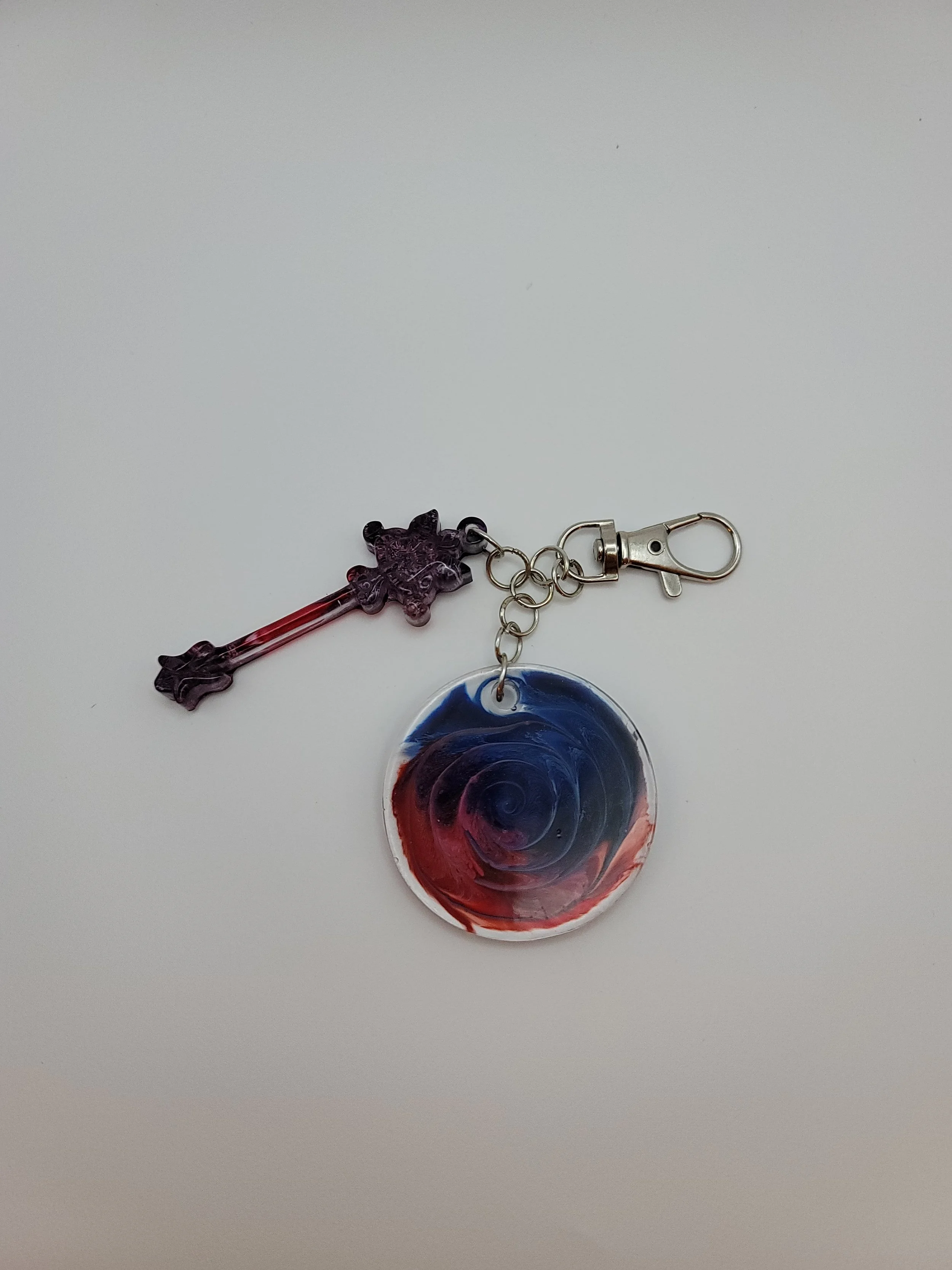 Red & Blue Swirl Circular Keychain with Wand Charm