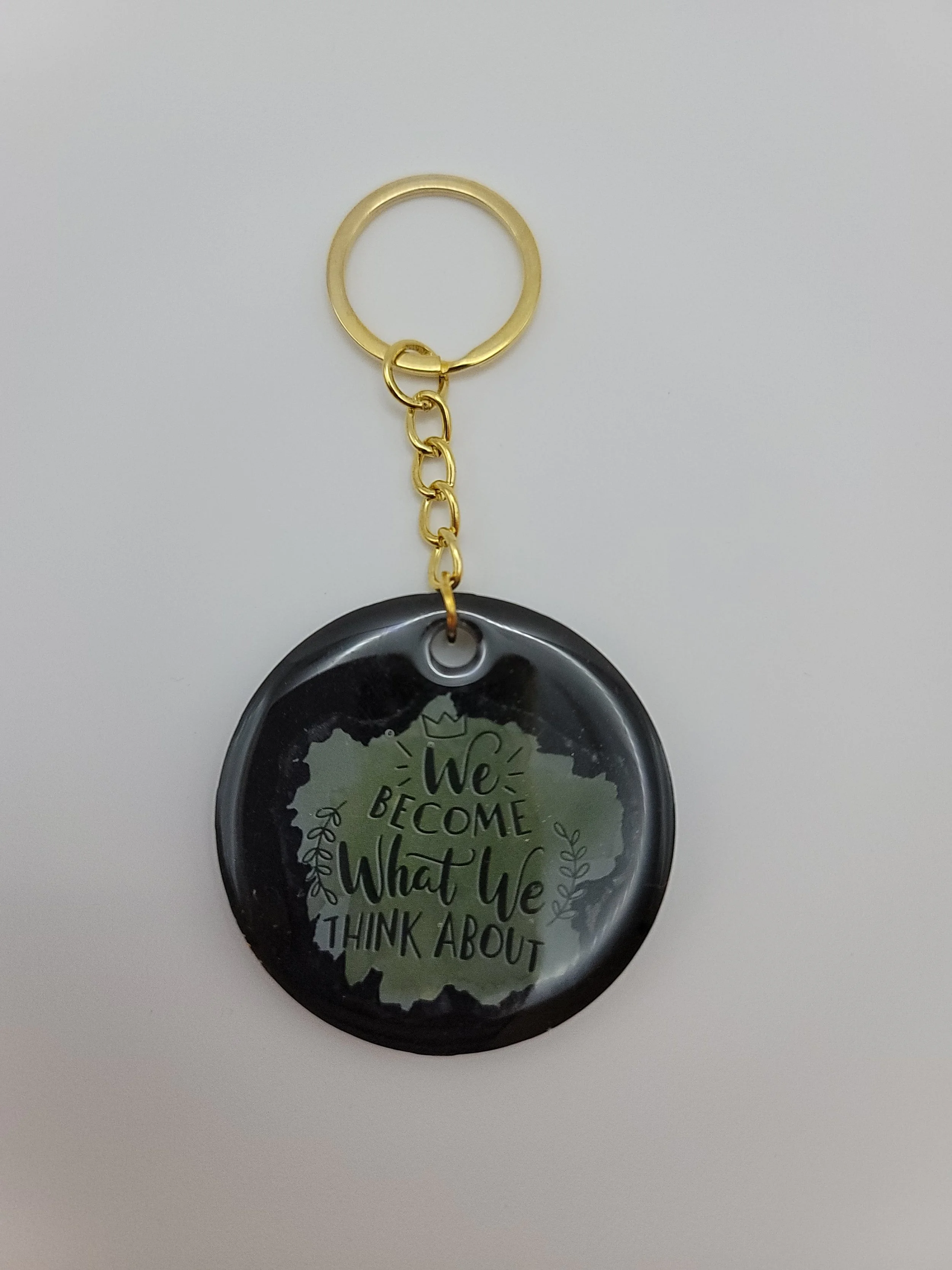 "We Become What We Think About" Black Keychain