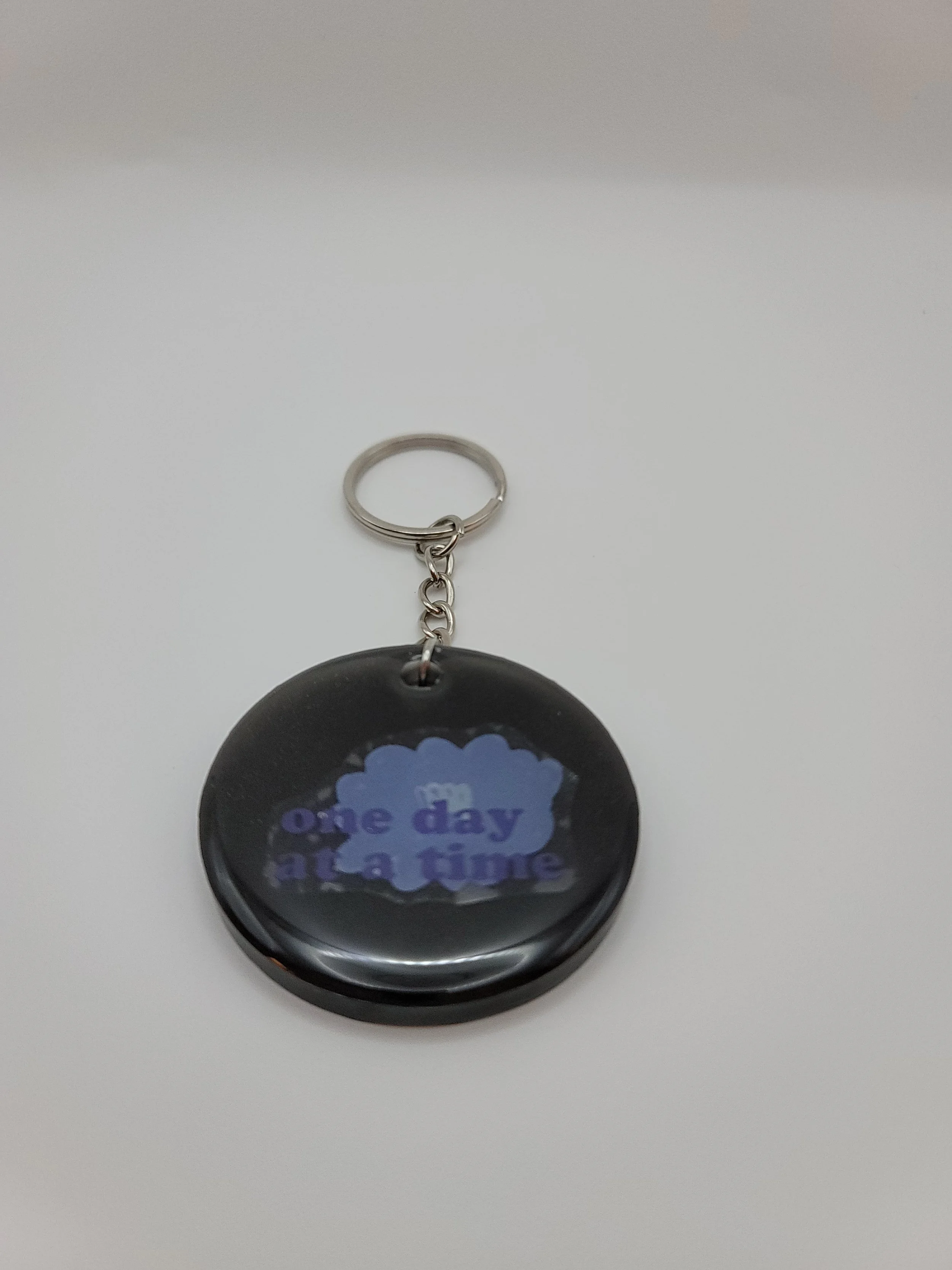 " One Day at a Time" Black Circular Keychain