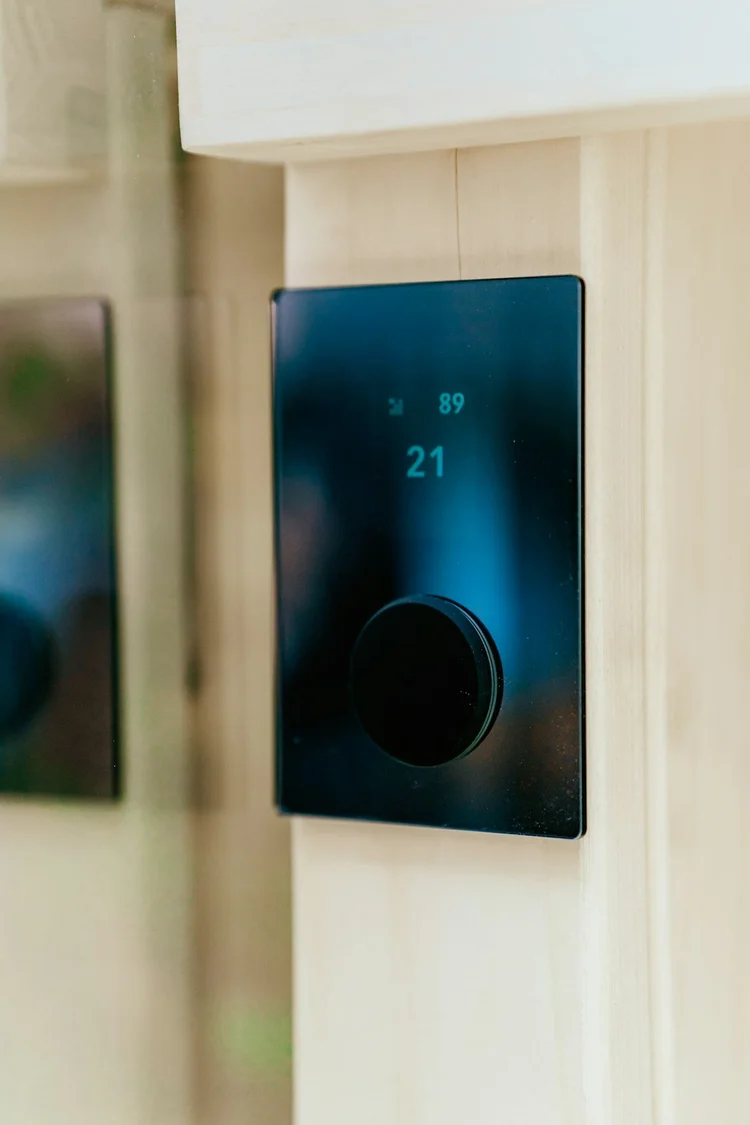 Smart thermostat on a wall