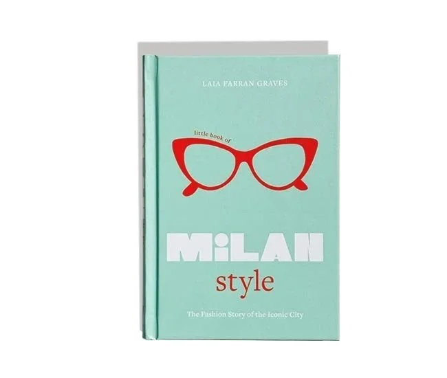 Libro con portada de color turquesa y ilustración de gafas rojas, titulado 'Milan Style' por Lala Farran Graves.