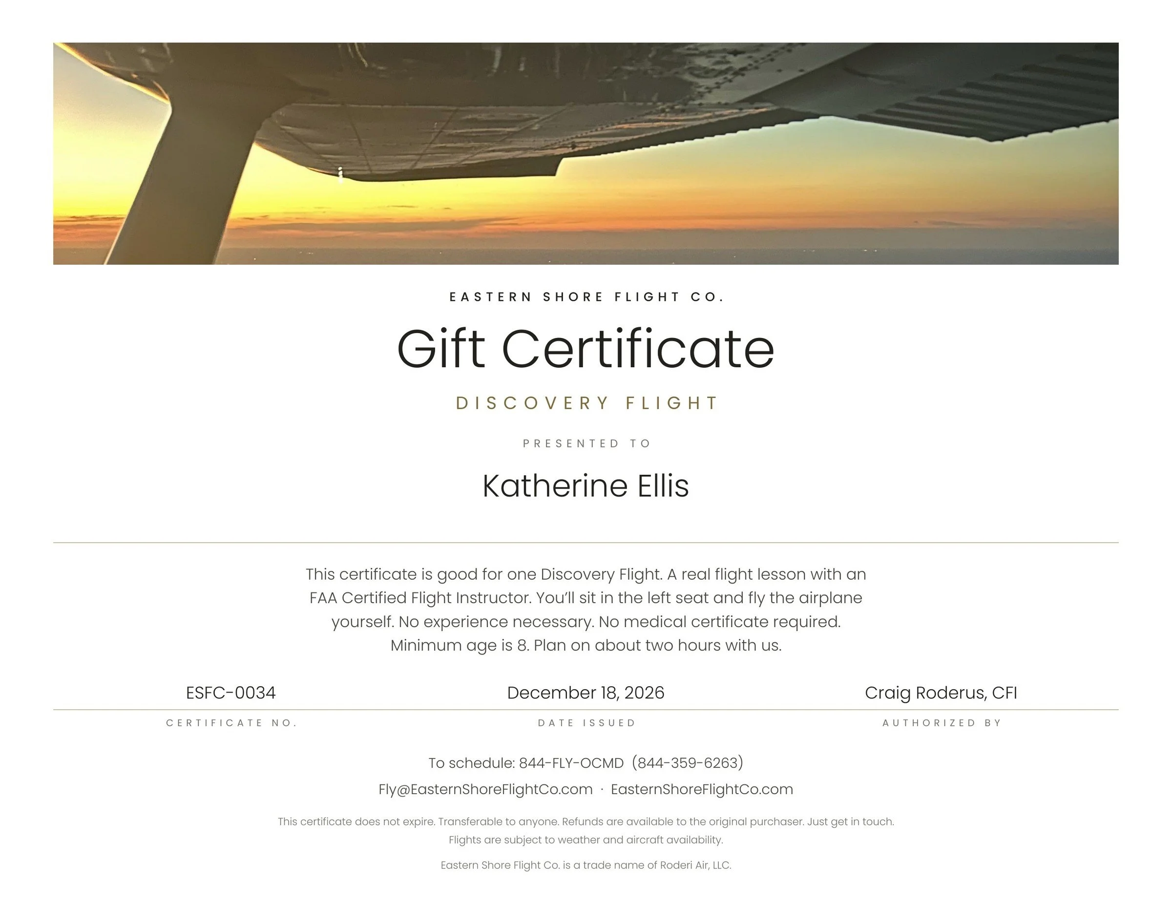 Gift certificate for a Discovery Flight from Eastern Shore Flight Co. featuring a view of an airplane wing at sunset.