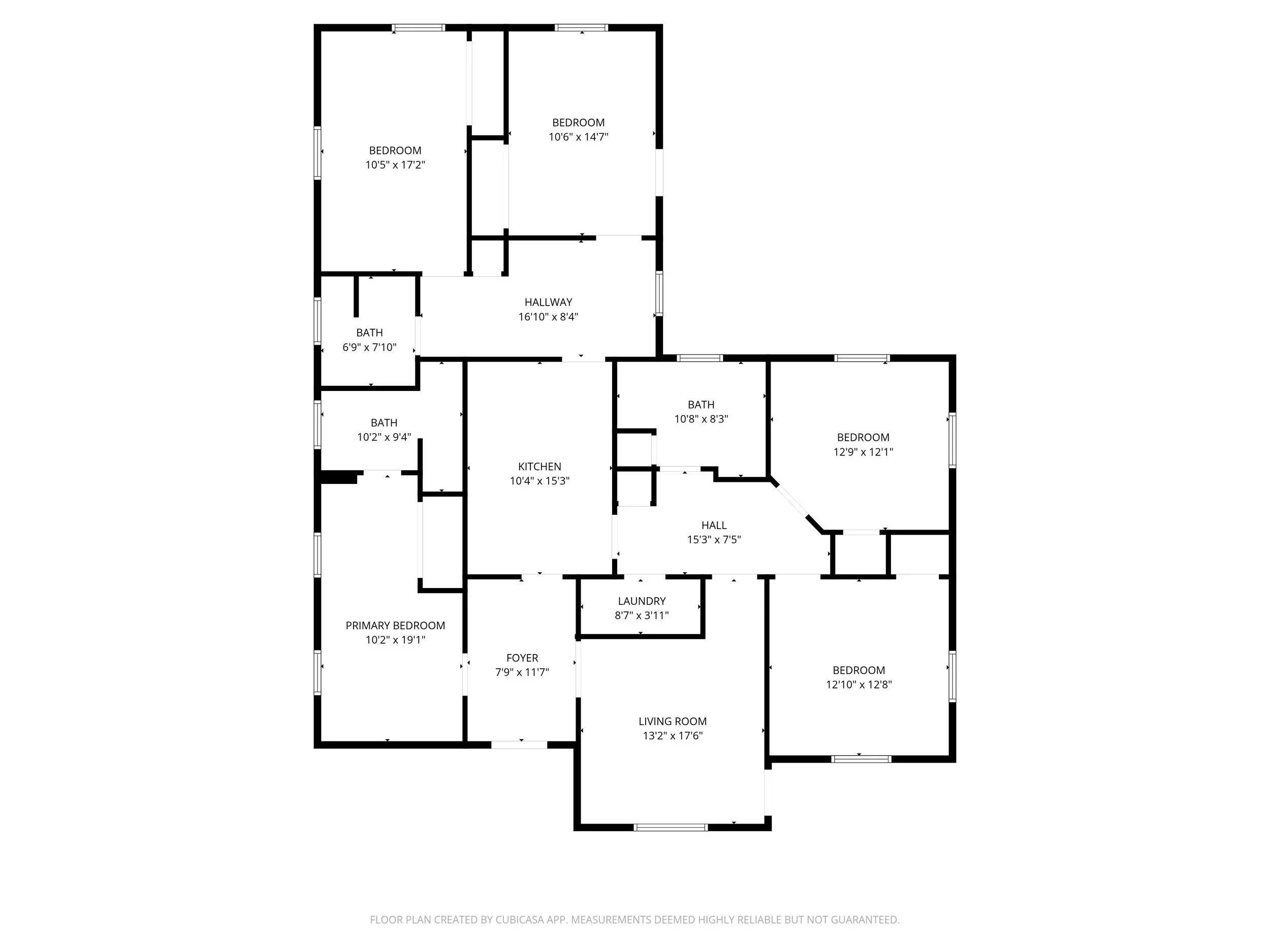 Floor plan of a house showing various rooms including bedrooms, bathrooms, kitchen, living room, laundry, foyer, and hall with dimensions marked for each room.