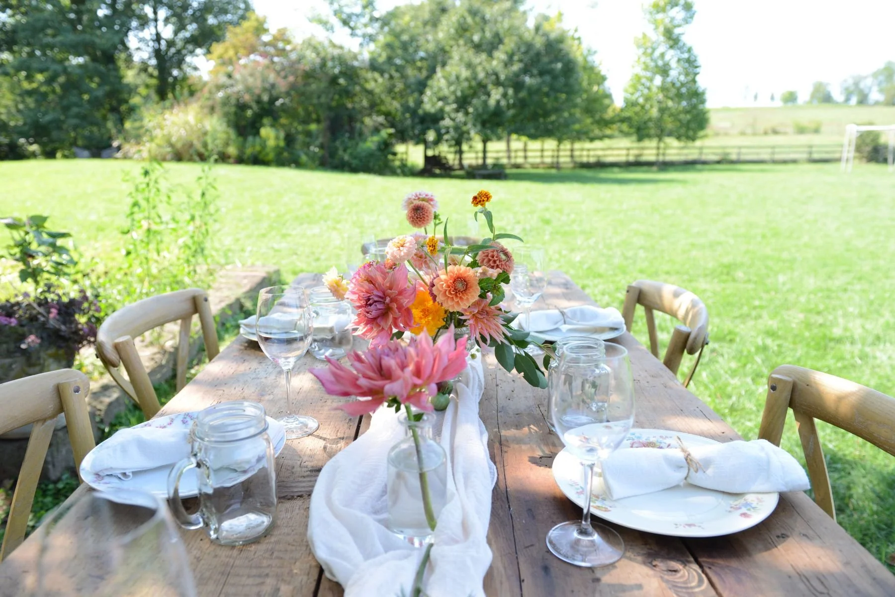 Outdoor dining table decorated with a floral centerpiece for private events at Rocklands Farm Winery